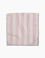 The Pink Summer dishtowel by Teri the Butter features alternating vertical pink and white stripes with a subtle herringbone texture, displayed flat on a white background.
