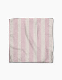 The Pink Summer dishtowel by Teri the Butter features alternating vertical pink and white stripes with a subtle herringbone texture, displayed flat on a white background.