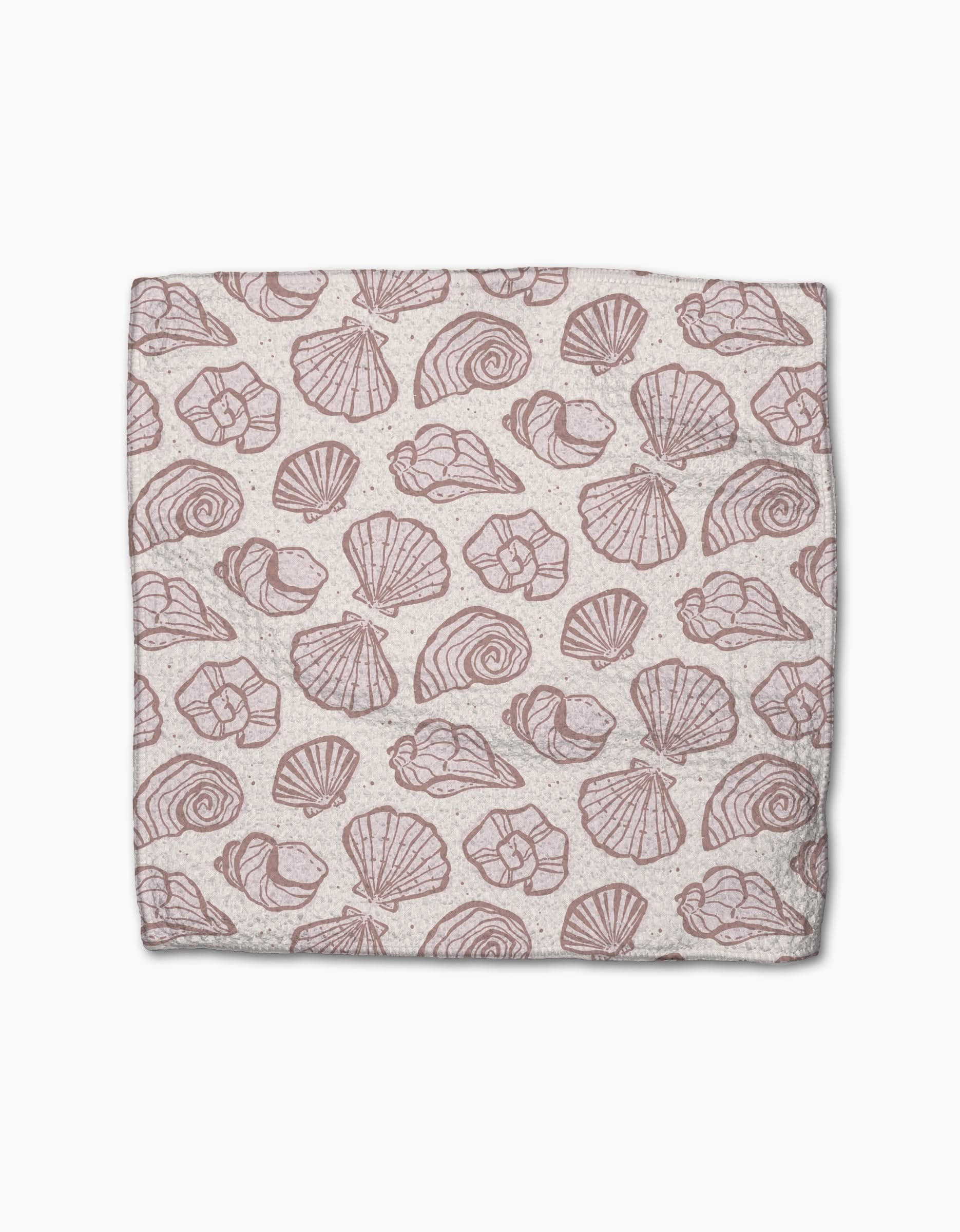 Pink Summer by Teri the Butter is a rectangular cloth made from recycled materials, featuring a repeating pattern of various pink seashell illustrations on a light beige background.