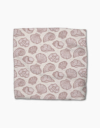 Pink Summer by Teri the Butter is a rectangular cloth made from recycled materials, featuring a repeating pattern of various pink seashell illustrations on a light beige background.