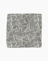 The Rhythm Current Stripes dishtowel by Sarah Daugherty features a folded, super-absorbent design with black and white geometric diagonal stripes, triangles, and dotted lines on a light background.