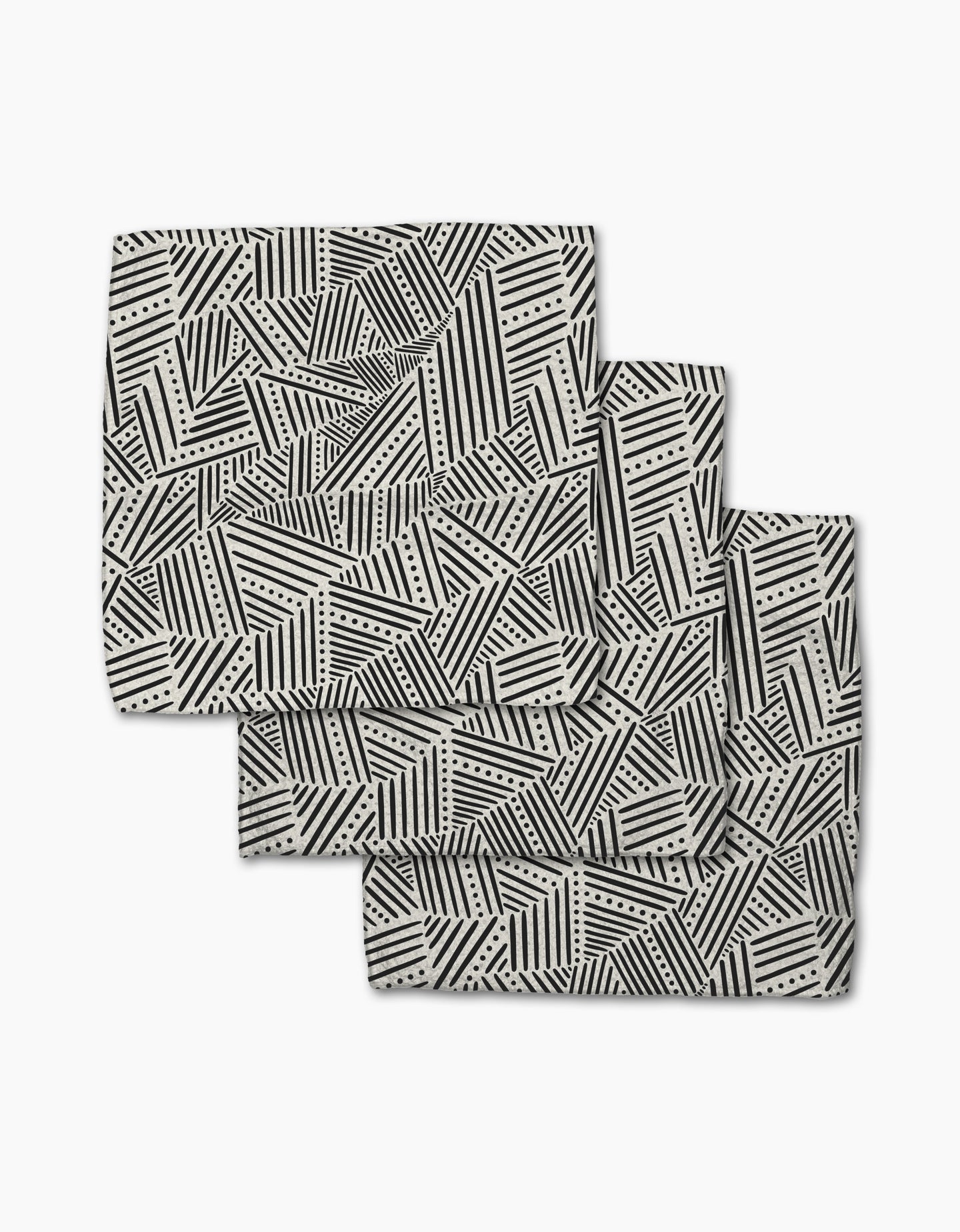 The Rhythm Current Stripes dishcloth set by Sarah Daugherty features three folded rectangular napkins with a black and white geometric pattern, made from recycled materials for a chic, eco-friendly addition to your home.