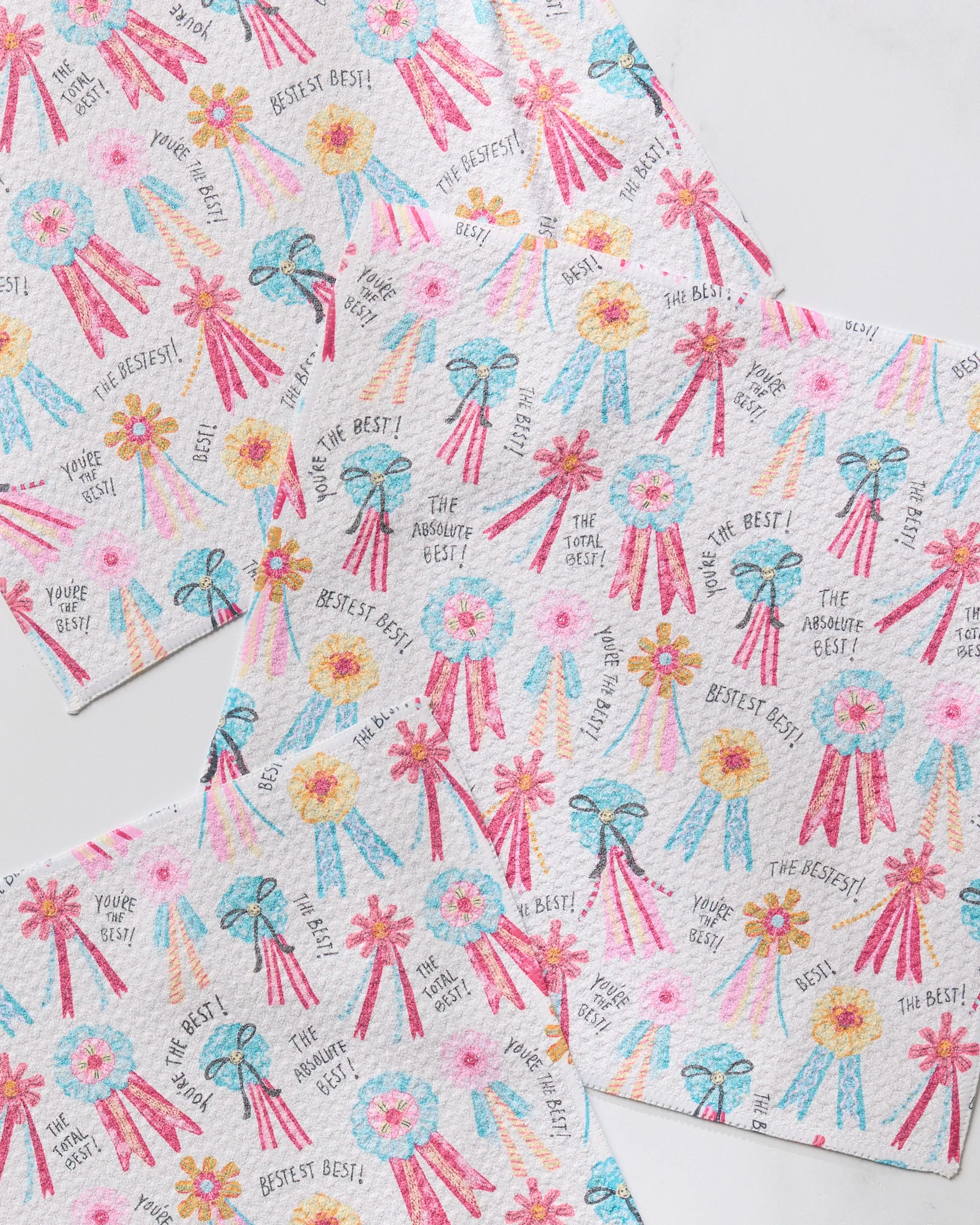 Brighten your table with Geometry’s Rosettes for You paper napkins, featuring pink, blue, and yellow award ribbons—pair them with our fast-drying dishcloths for a cheerful look that celebrates being THE ABSOLUTE BEST!.