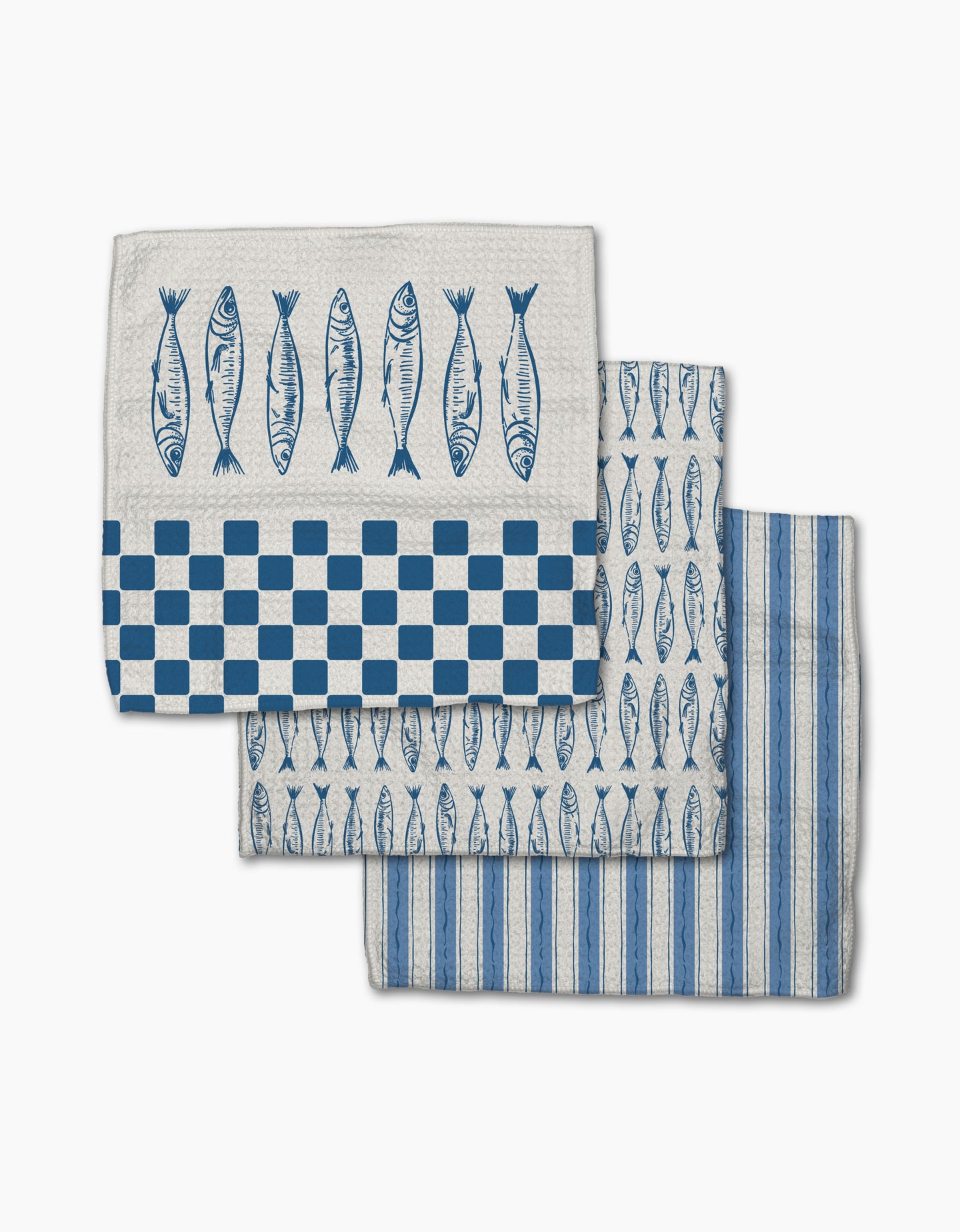 The Sardine Check Blue set from Hufton Studio includes three white Geoweave dishcloths: one with fish and checks, one with rows of fish, and one with vertical blue stripes—all designed for extra durability.