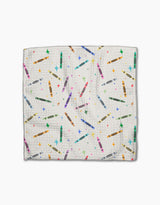 The Scribble Squad by Vaishali Design Studio features a white textured Geoweave fabric adorned with colorful crayons and multicolored stars, shown on a plain white background.