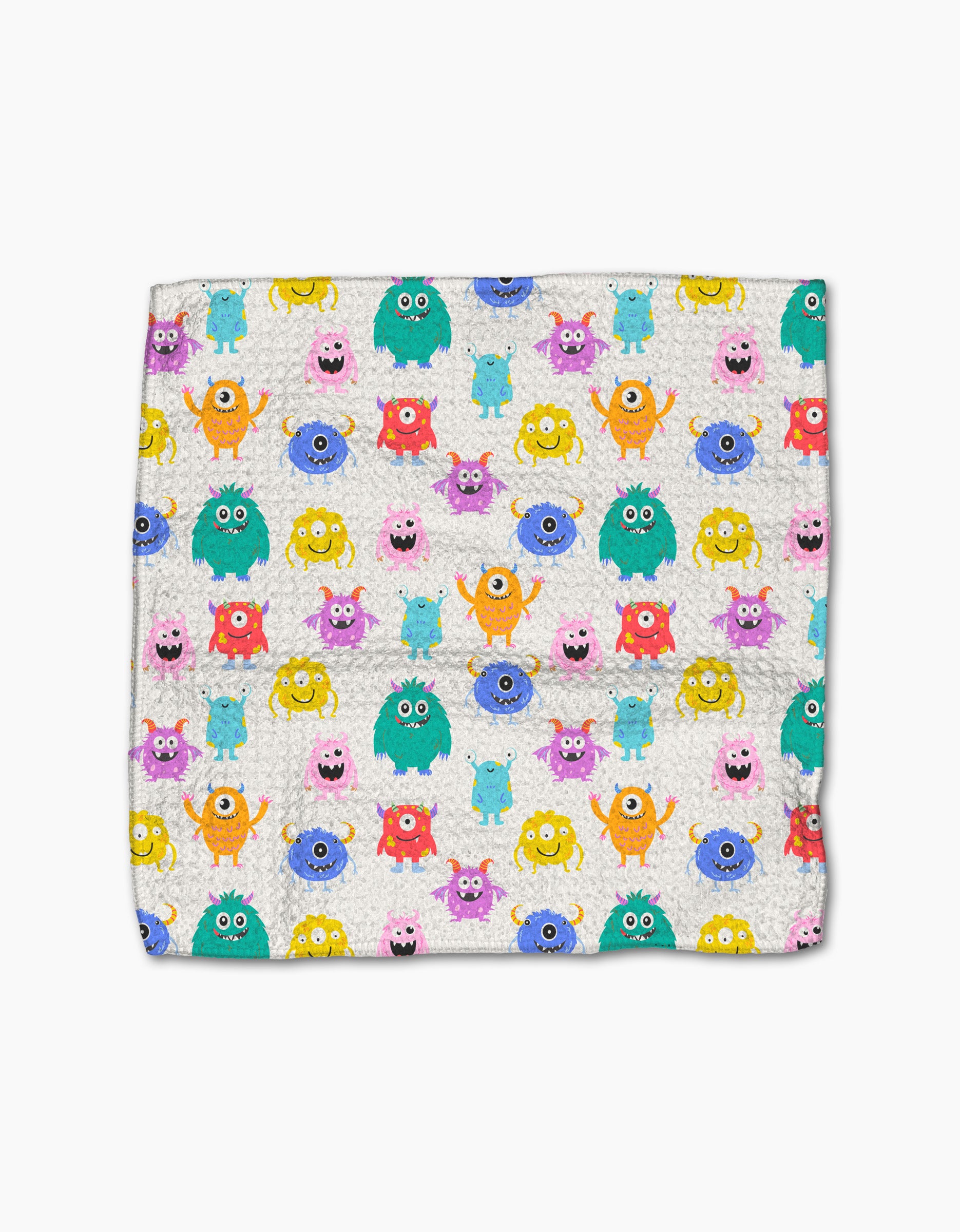 The Scribble Squad blanket by Vaishali Design Studio features a colorful pattern of cartoon monsters in unique shapes and colors on a white background, made from recycled materials for an eco-friendly, playful touch.