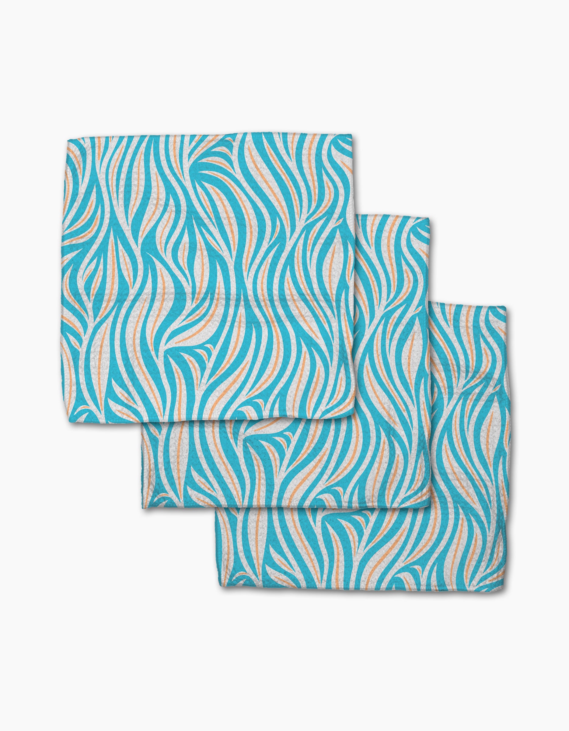 Three folded Rachel Parker Sky Willow Wave cloth napkins, made from recycled materials, display a blue, orange, and white wavy abstract pattern. They are stacked with slight overlap on a white background.