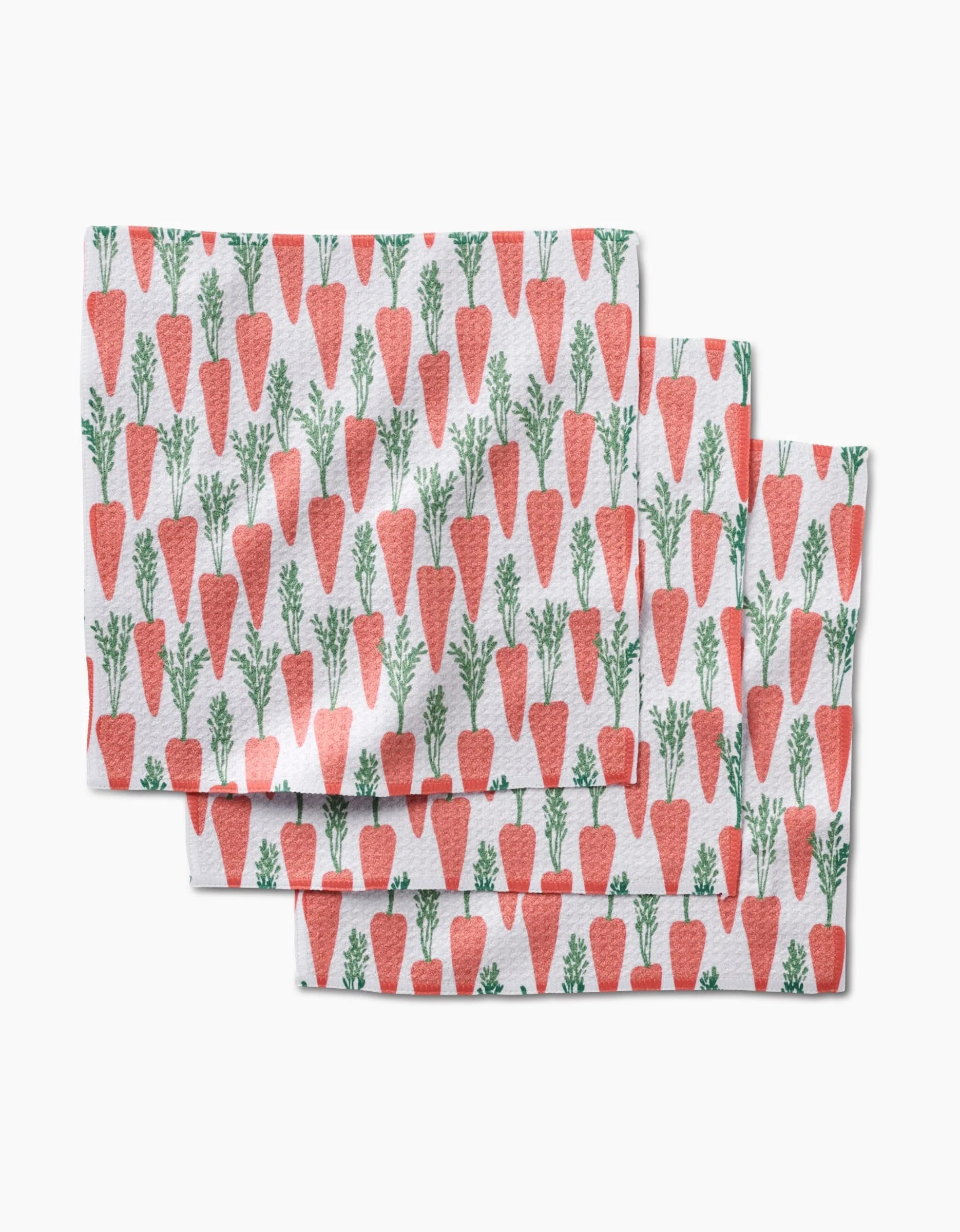 The Spring Carrot Hill dishcloth set by Hufton Studio includes three super-absorbent towels with playful orange carrot and green top patterns on white—perfect for brightening your kitchen.