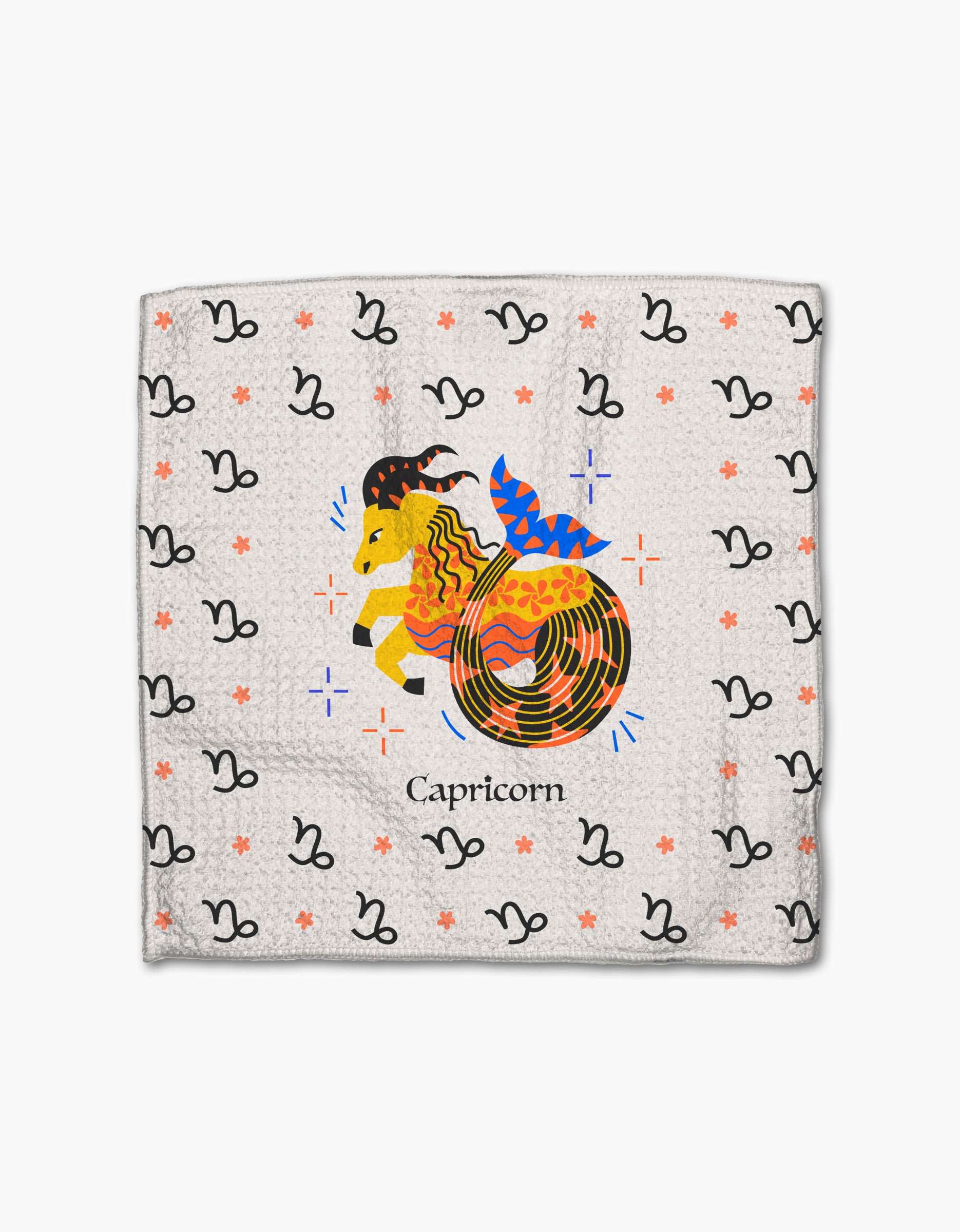 The Steadfast Capricorn dishcloth set by Heather Zhou features a vibrant Capricorn goat with a fish tail, black glyphs, and orange stars on white—crafted from recycled materials.