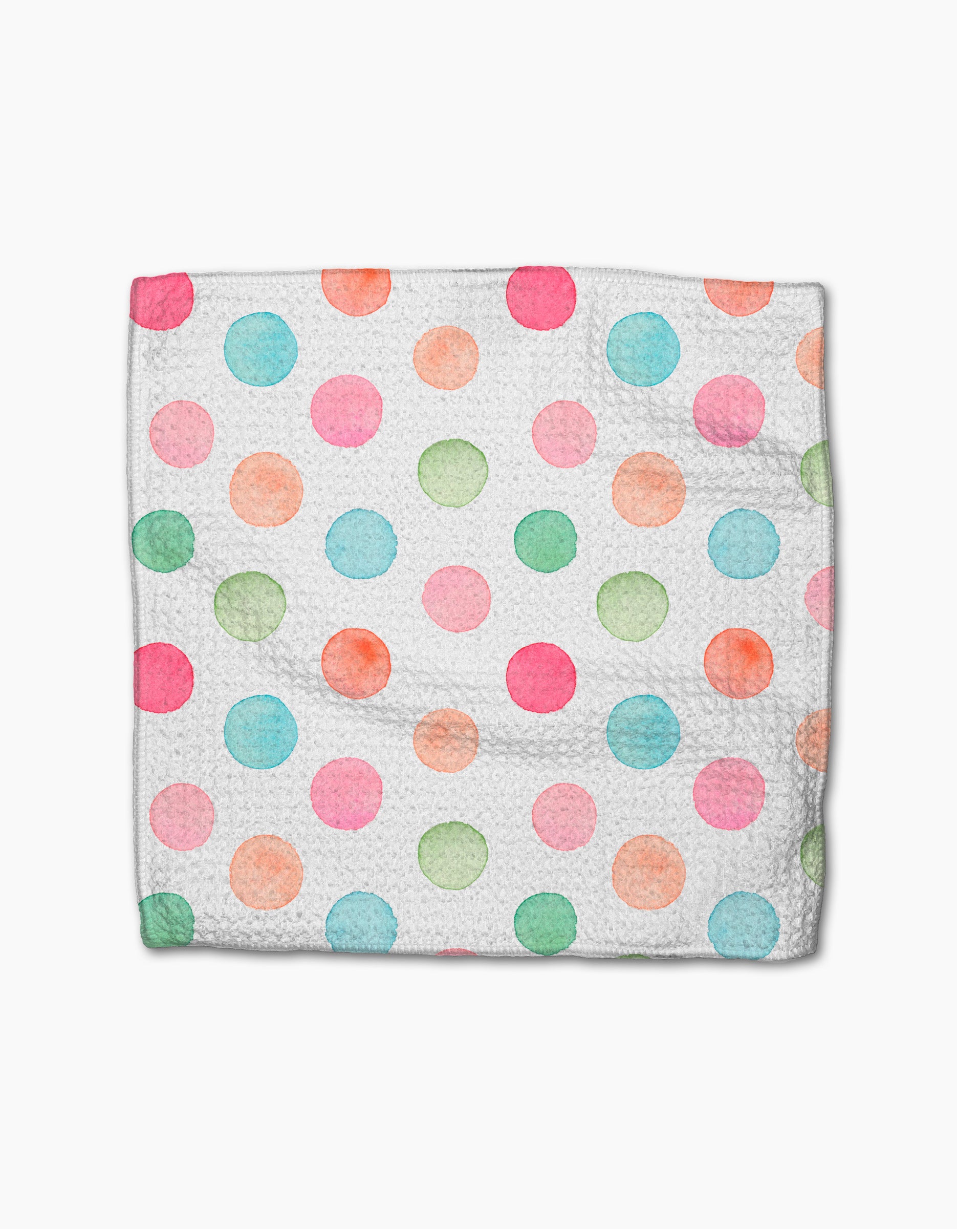 A Sweet Macarons cloth napkin by Elena Fay features a white Geoweave fabric adorned with watercolor polka dots in pink, blue, green, and orange, laid flat on a white background.
