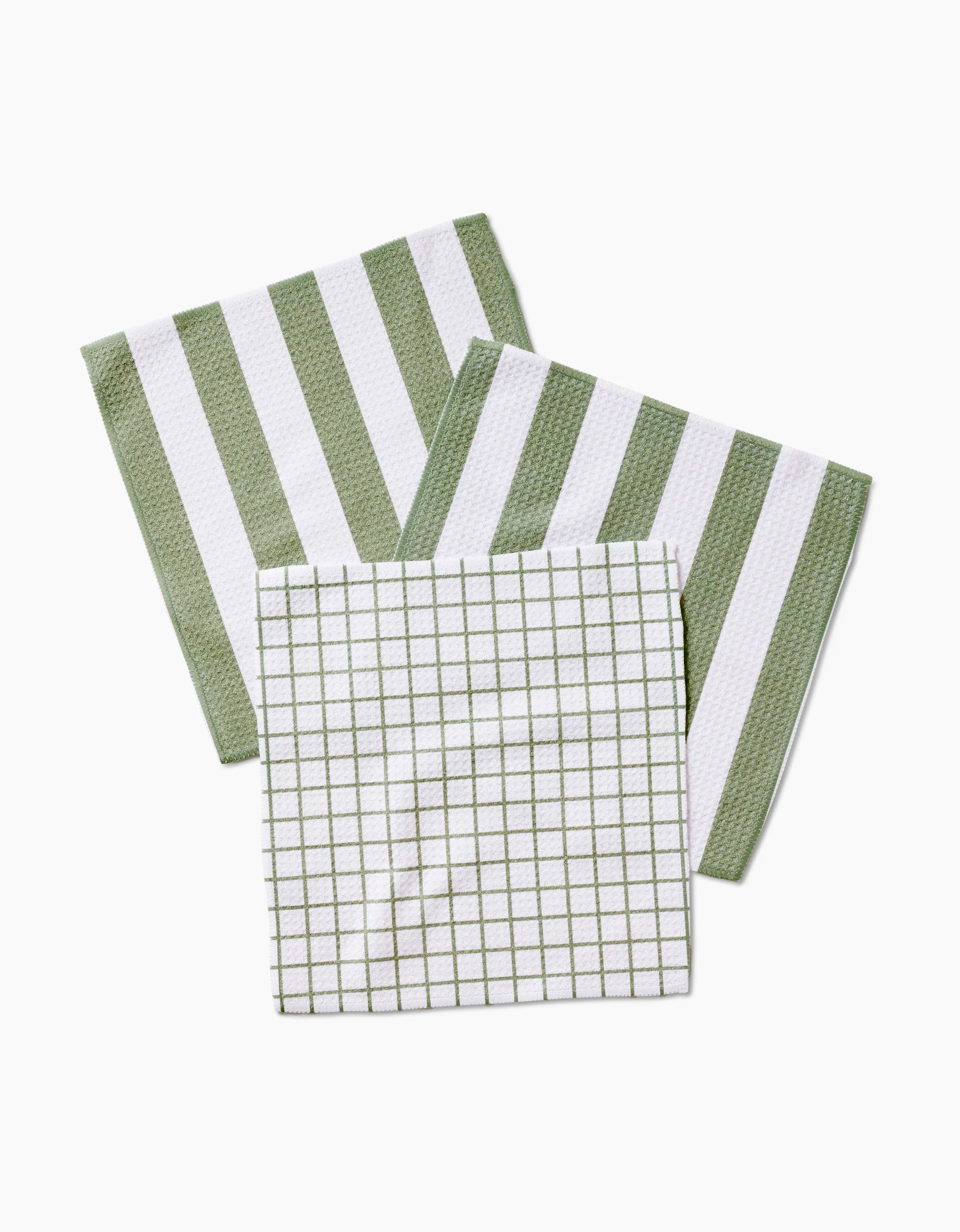 Three Sweet Mint cloth napkins by Kailee Wright are displayed—two with thick green and white stripes, one with a grid pattern—all made from eco-friendly Geoweave fabric and arranged neatly on a white background.