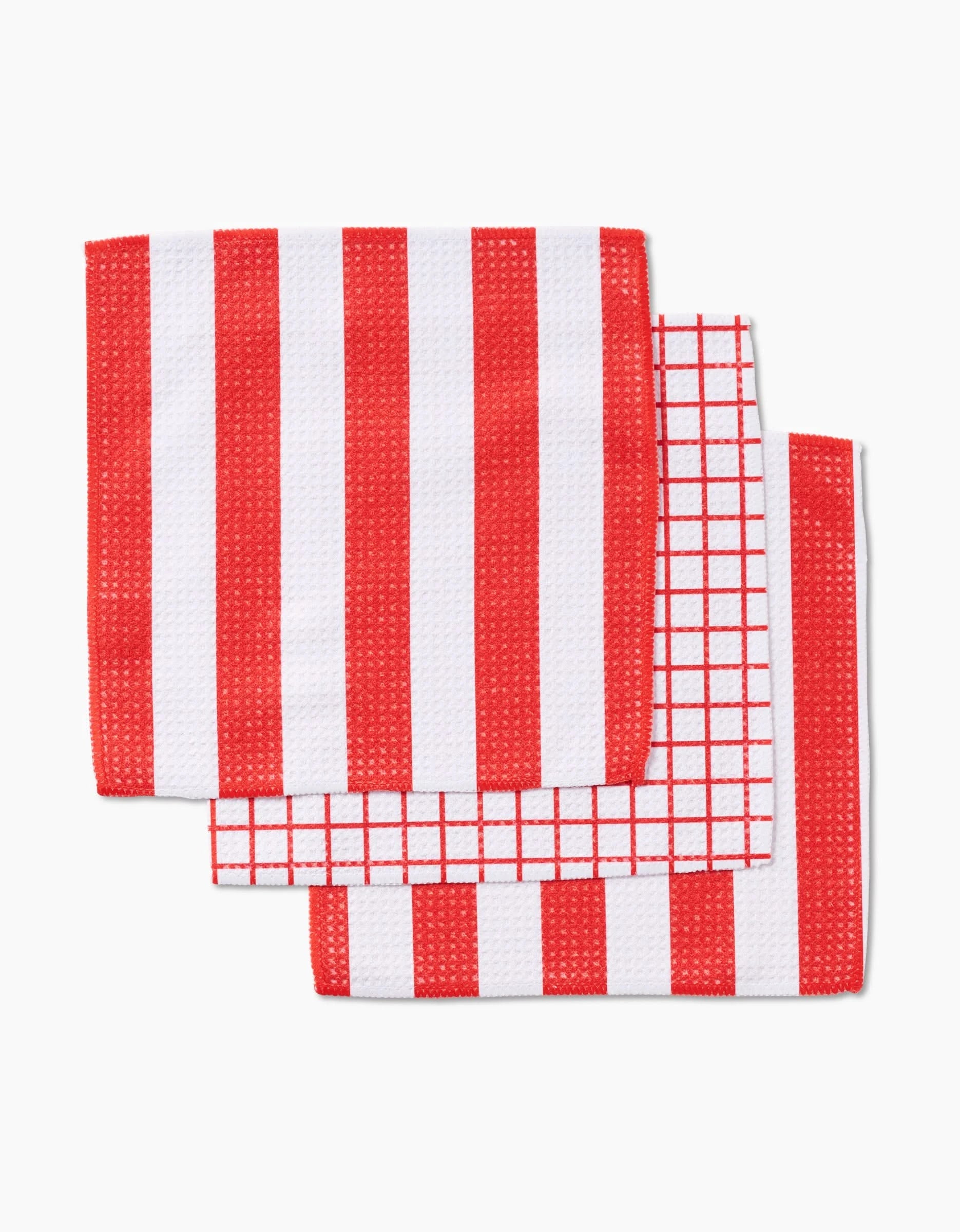 Three red and white Sweet Peppermint dishcloths from Kailee Wright are shown: two with bold vertical stripes and one with a grid pattern, all fast-drying, neatly folded, and arranged on a white background.