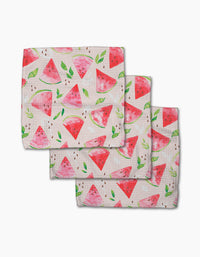 Three stacked Elena Fay Watermelon Slice dishcloths feature colorful watermelon slices, seeds, and green leaves on a light background, made from durable Geoweave fabric.