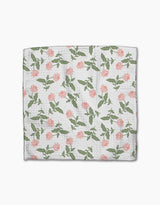The Danelys Sidron Wildflower Vine Blush is a white Geoweave dishcloth made from recycled materials, featuring pink flower and green leaf patterns evenly scattered across the surface.