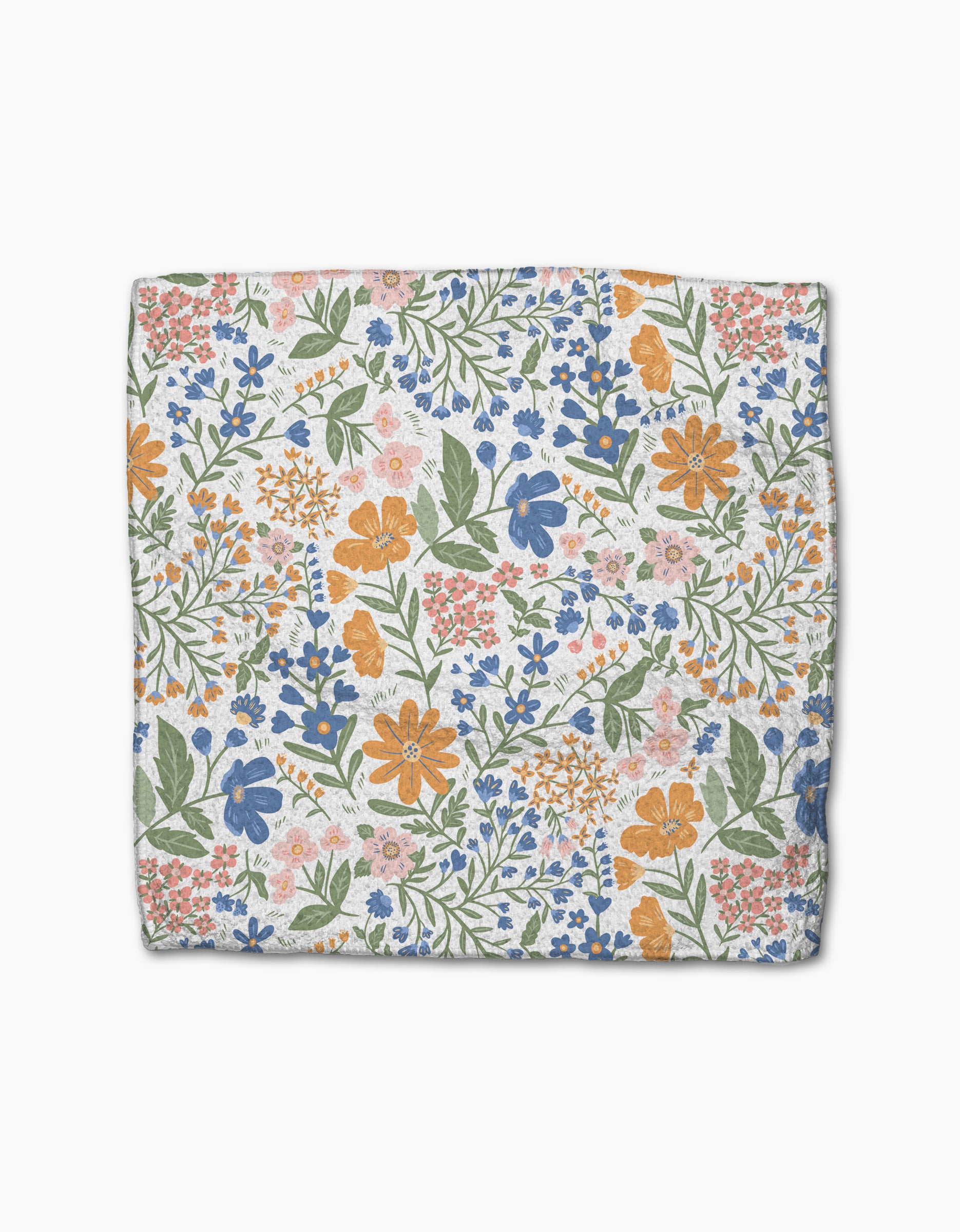 The Wildflower Vine Blush dishcloth by Danelys Sidron features a densely packed floral pattern in orange, blue, pink, and green on white Geoweave fabric, and is crafted from recycled materials.