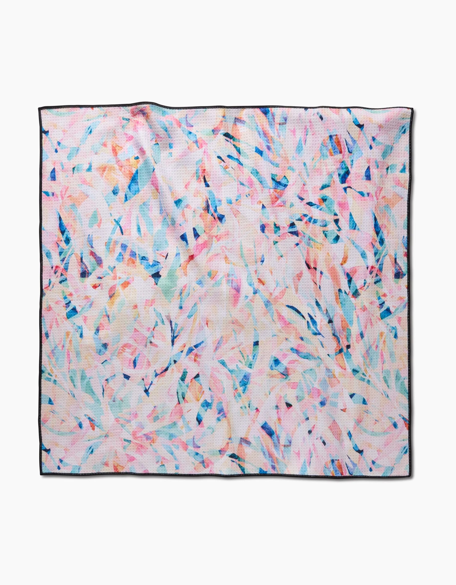 The Rachel Parker Abstract Jungle Dog Towel features a square shape with a colorful abstract leaf pattern in pink, blue, and orange, thin black edging, and is highly absorbent and quick-drying. Shown on a white background.