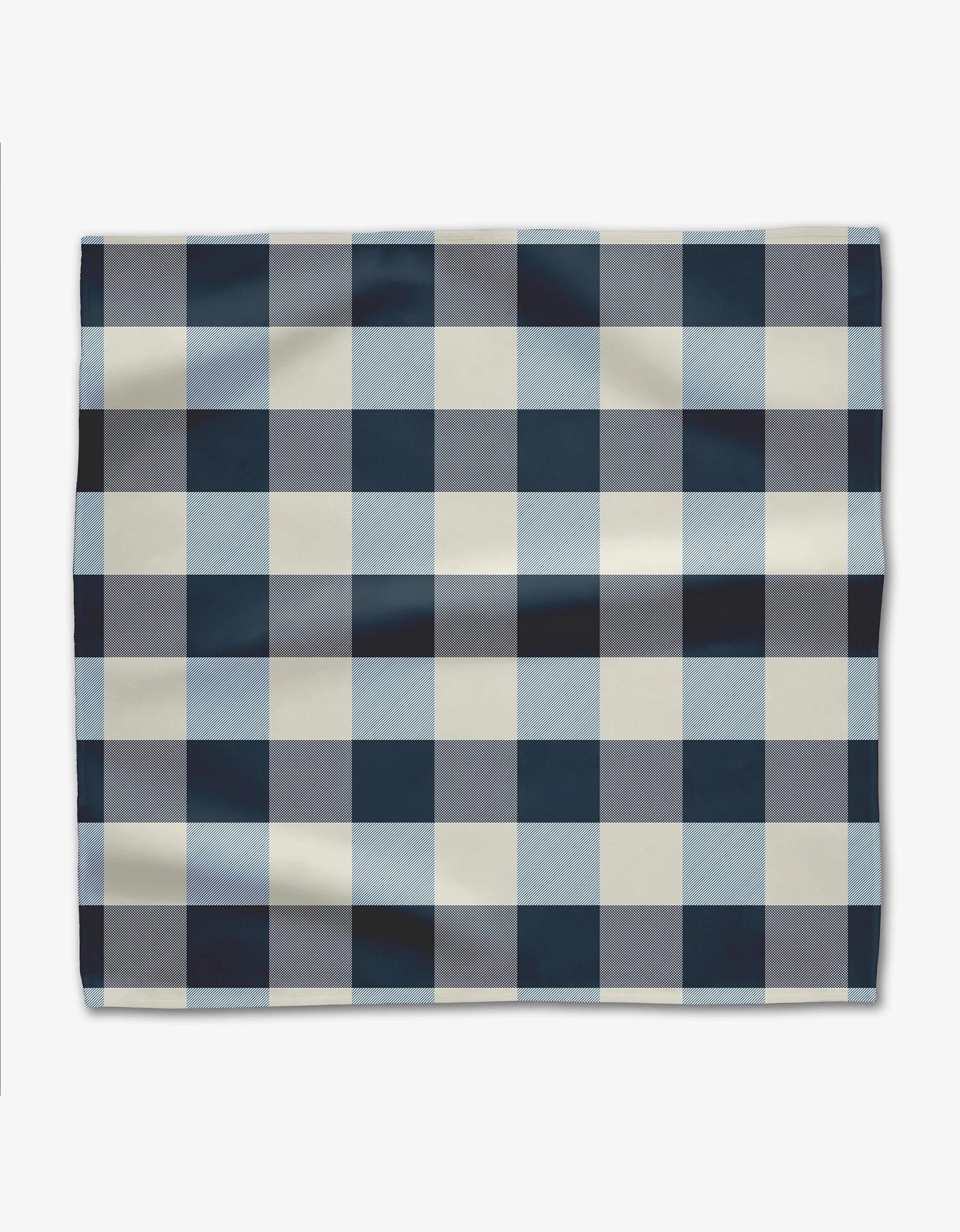 The GEOMETRY Seafaring rectangular cloth dinner napkin, made from Geosuede fabric, features a blue, white, and light gray buffalo check plaid pattern and is shown on a plain white background.