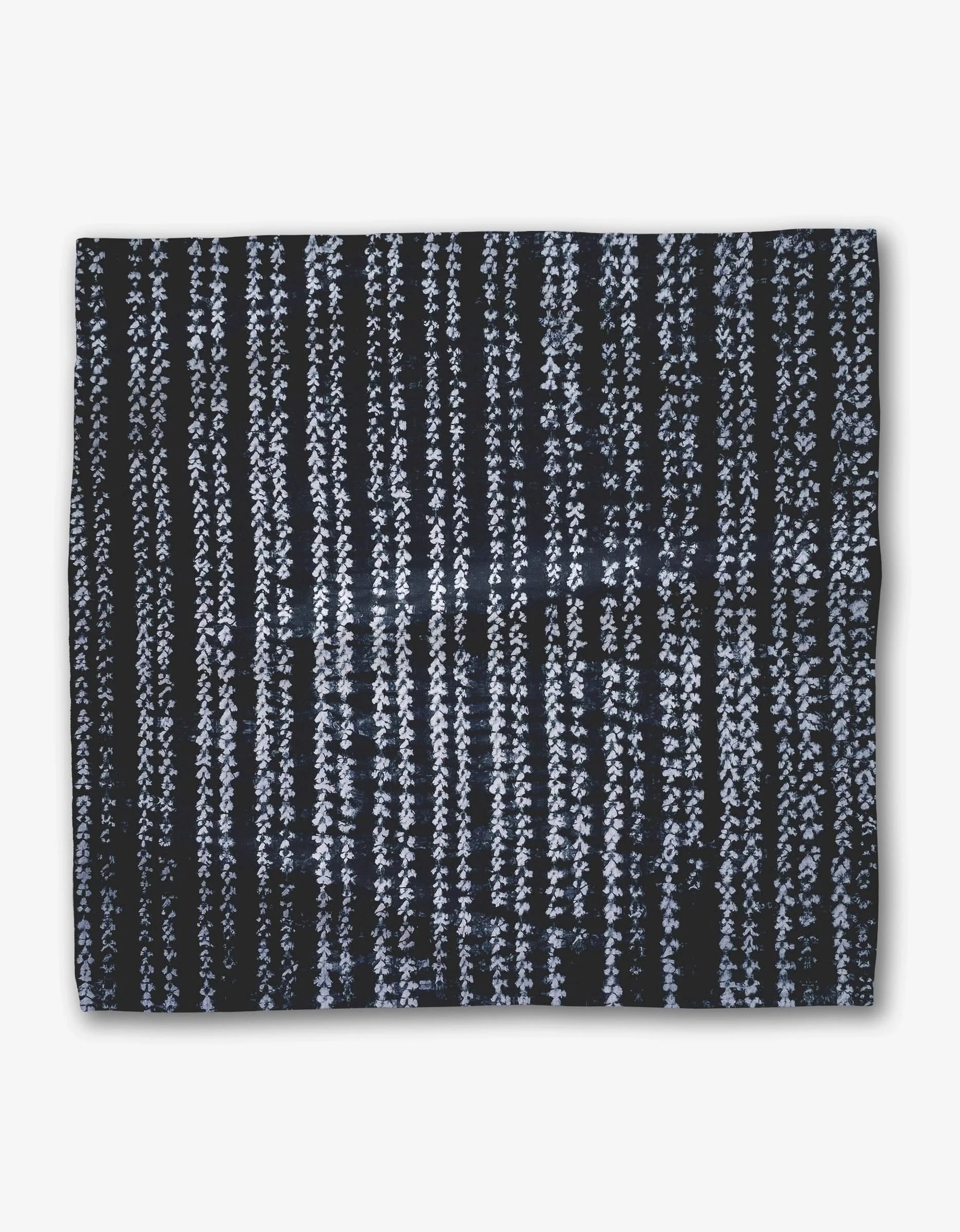 Shibo by GEOMETRY features dark Geosuede fabric with vertical white, textured dashed stripes on a light background—perfect for an elegant dinner napkin set.