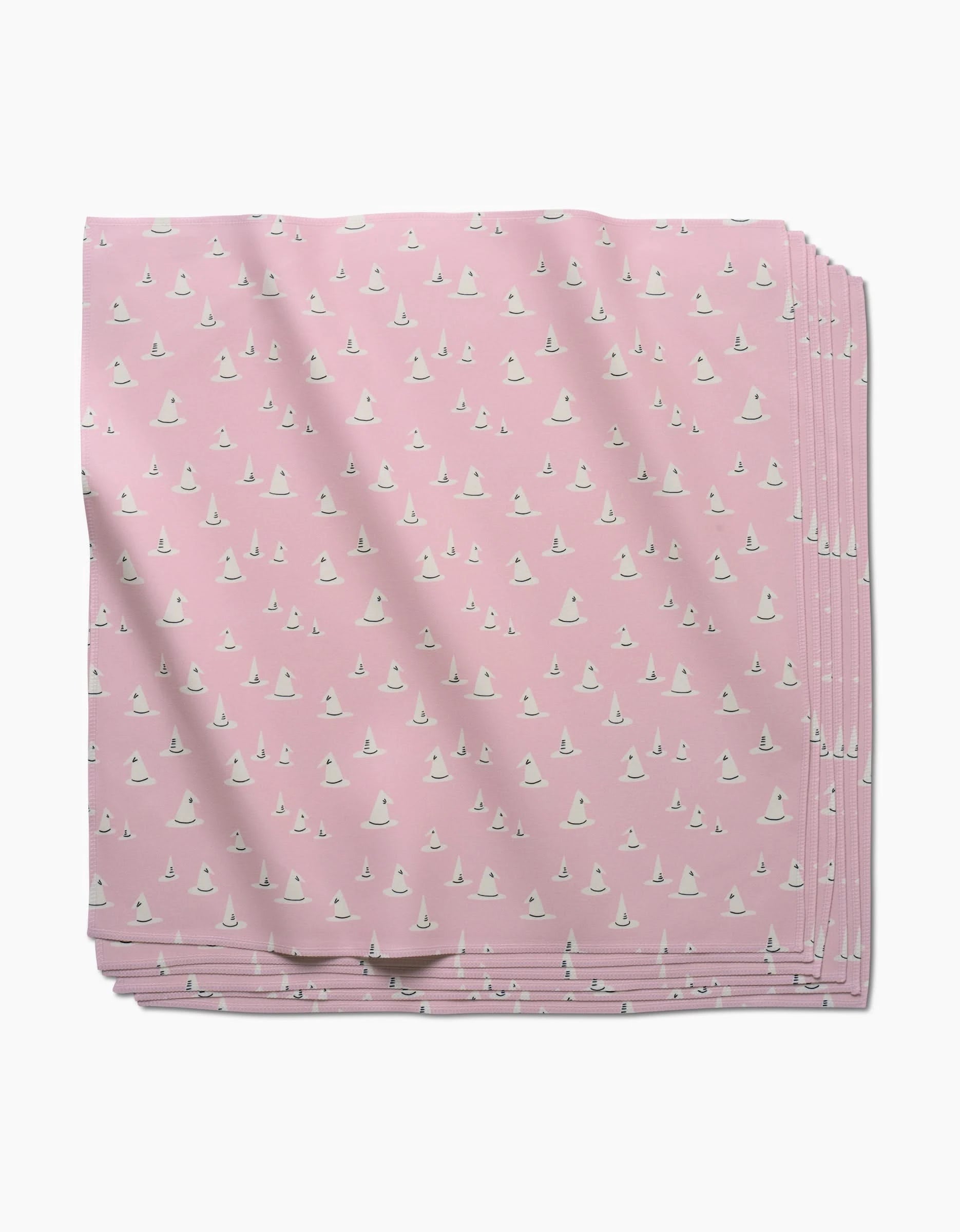 The Belladonna dinner napkin set by Amy MacCready features eco-friendly pink cloth napkins with a charming pattern of small white witch hats, adding sustainability and style to your table.