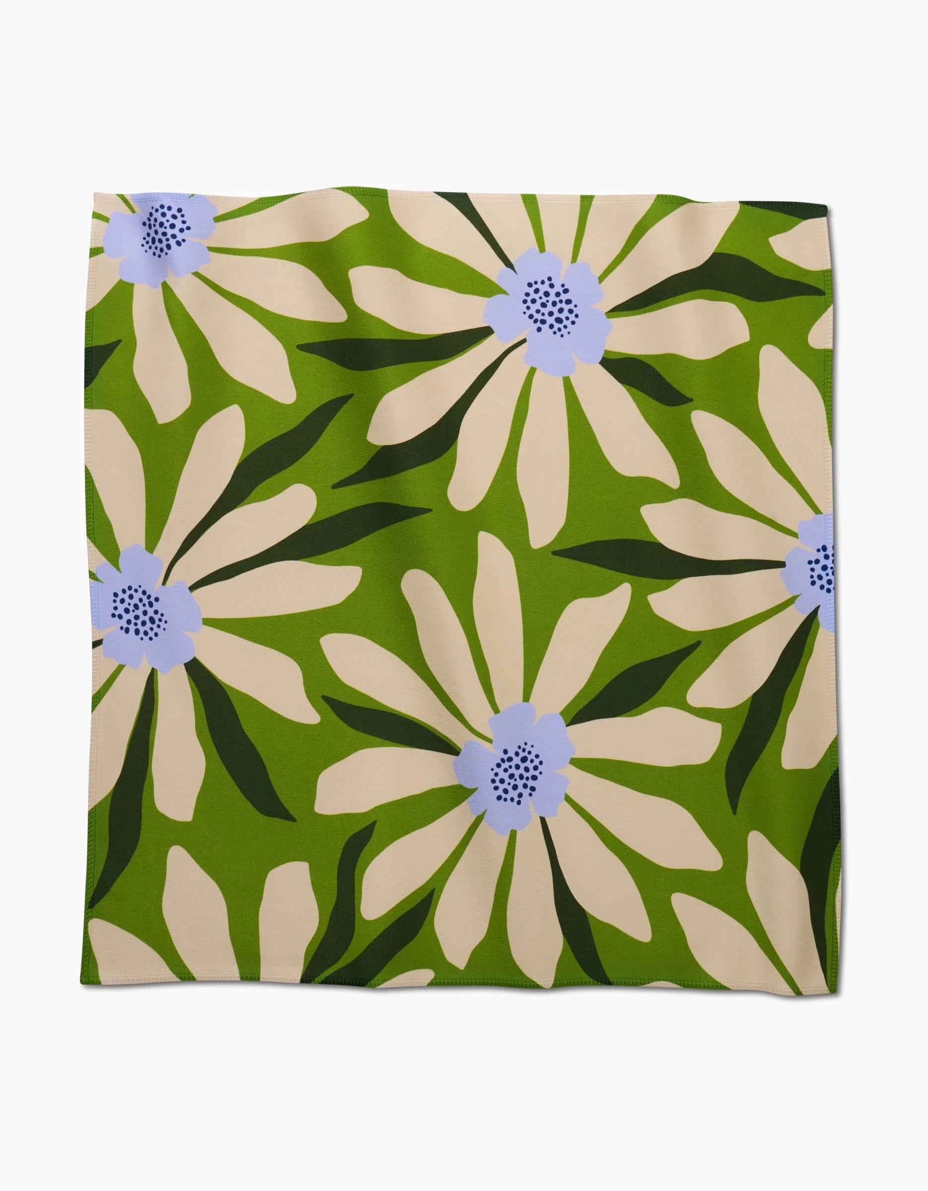 Bliss and Bloom by GEOMETRY is a square dinner napkin crafted from soft Geosuede fabric, featuring bold floral patterns with cream petals, light purple centers with black dots, and dark green leaves on an olive background.