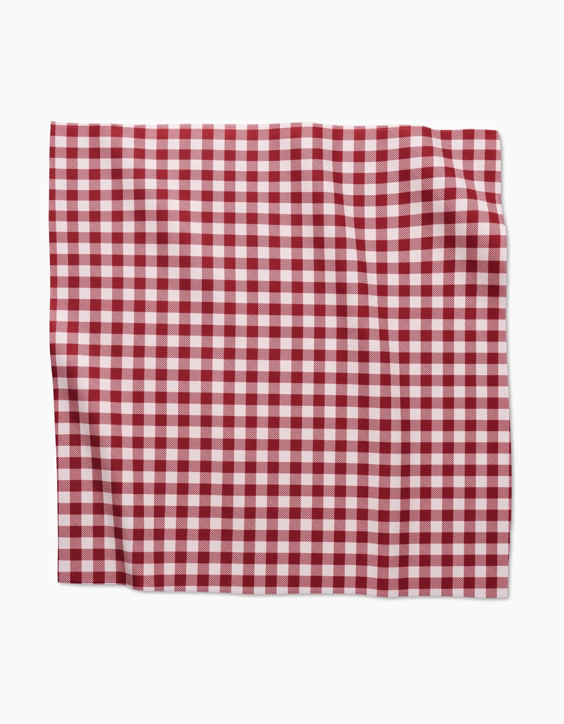 The Aubrey Fairchild Christmas Gingham features a red and white checkered cloth with a classic gingham pattern—ideal as an eco-friendly napkin or for use in a festive dinner napkin set.