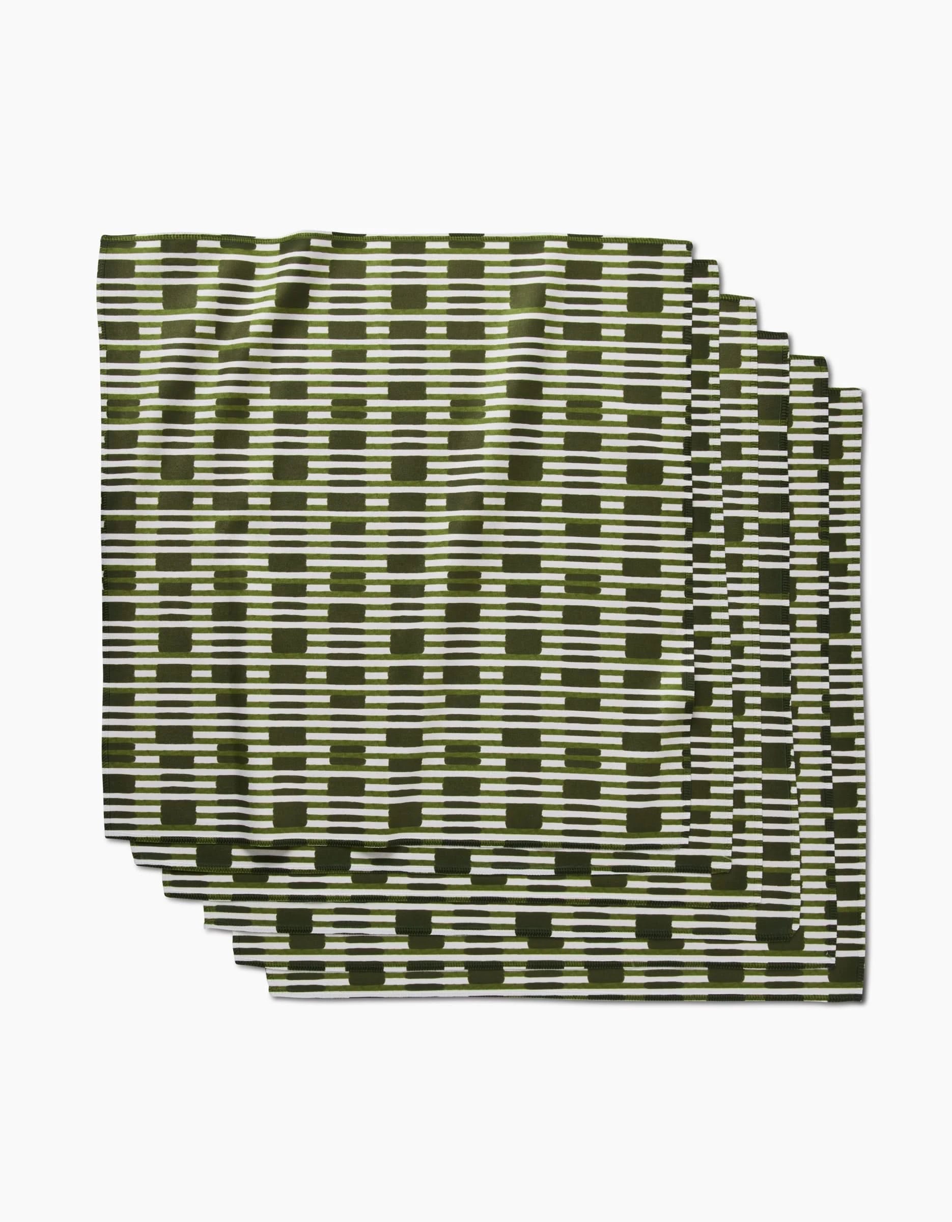 Clover Stripe by GEOMETRY features folded Geosuede fabric with a black and white geometric grid of horizontal and vertical lines on a white background. Made from recycled materials for an eco-friendly touch.