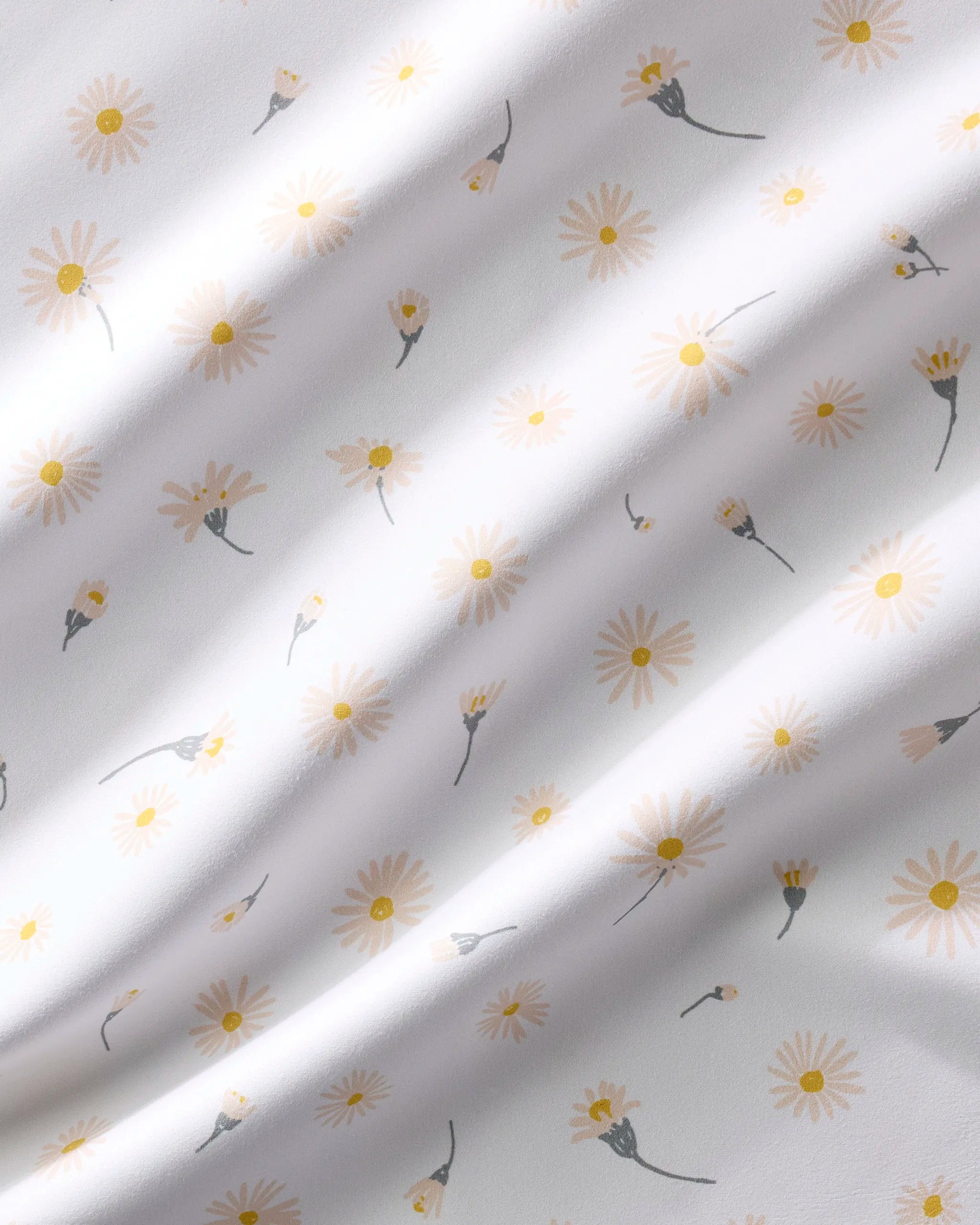 Daisy Dust by Hufton Studio features a white fabric adorned with scattered small yellow and white daisies, creating a soft, delicate floral pattern—ideal for recycled dinner napkins or any dinner napkin set.