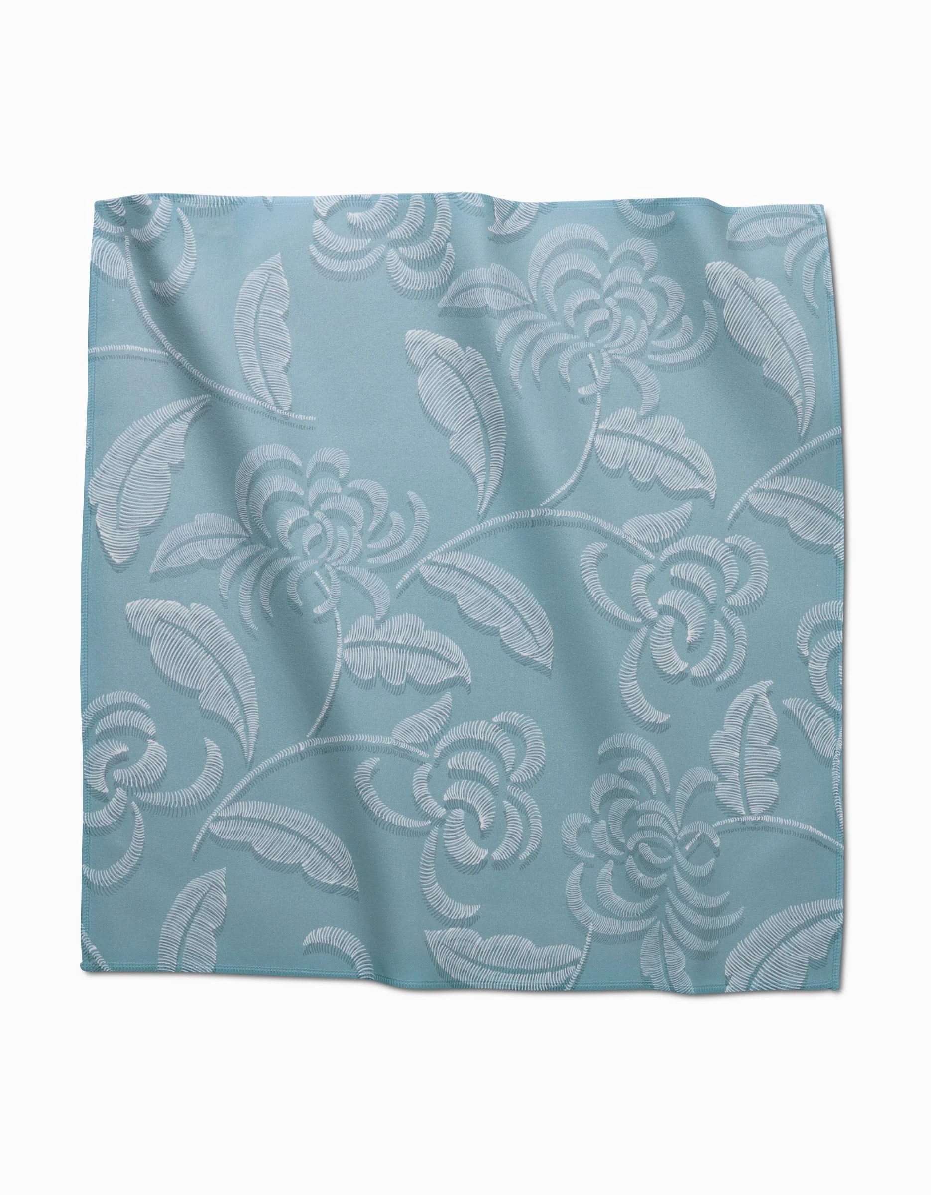 The GEOMETRY Ediths Embroidery dinner napkin set features light blue Geosuede fabric with an elegant, raised floral and leaf pattern in slightly lighter shades.