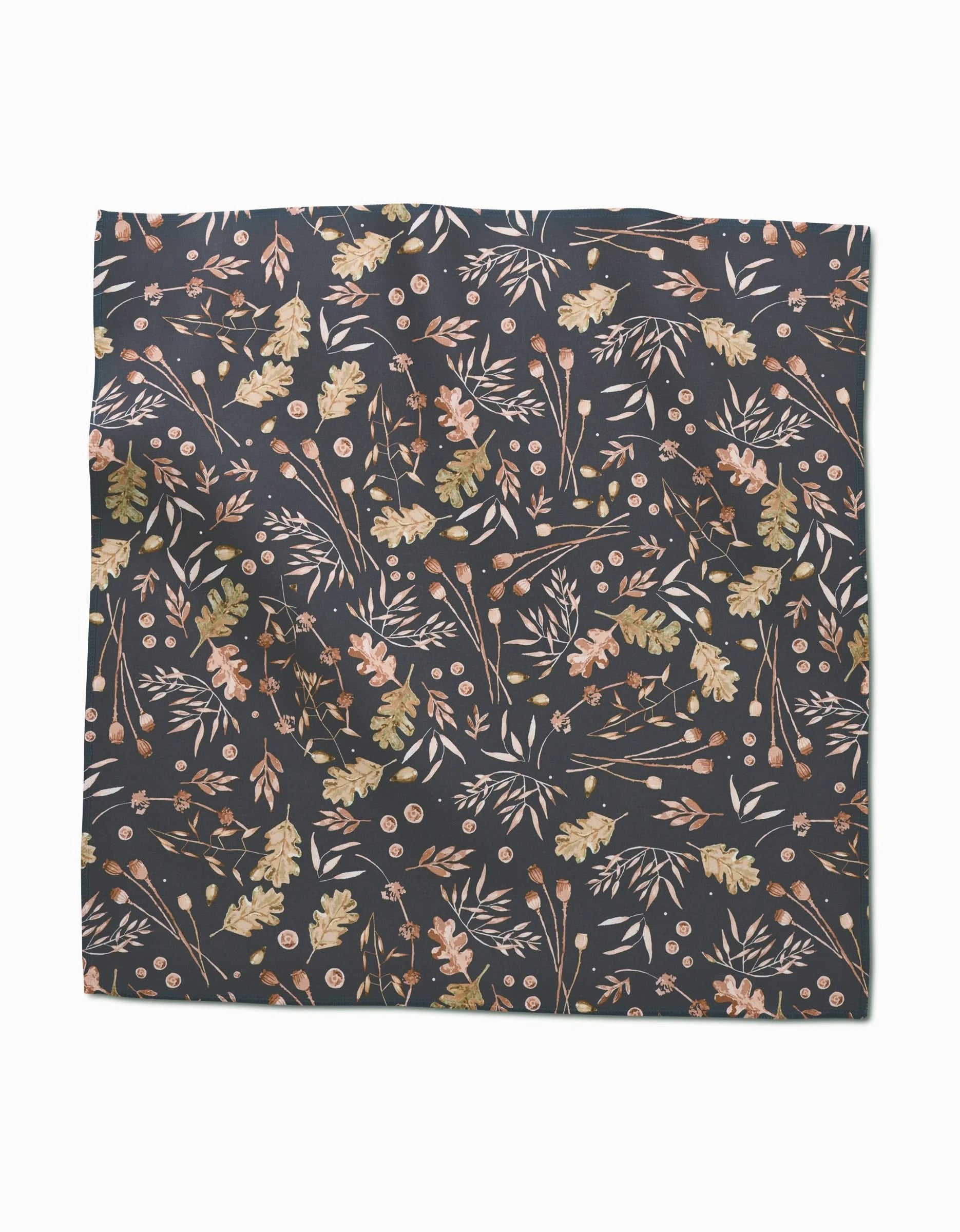 The Fallen Oak dinner napkin set by Katie OShea features square Geosuede fabric with a dark background, adorned with light brown, beige, and olive green leaves, branches, and berries for an autumn-inspired look.