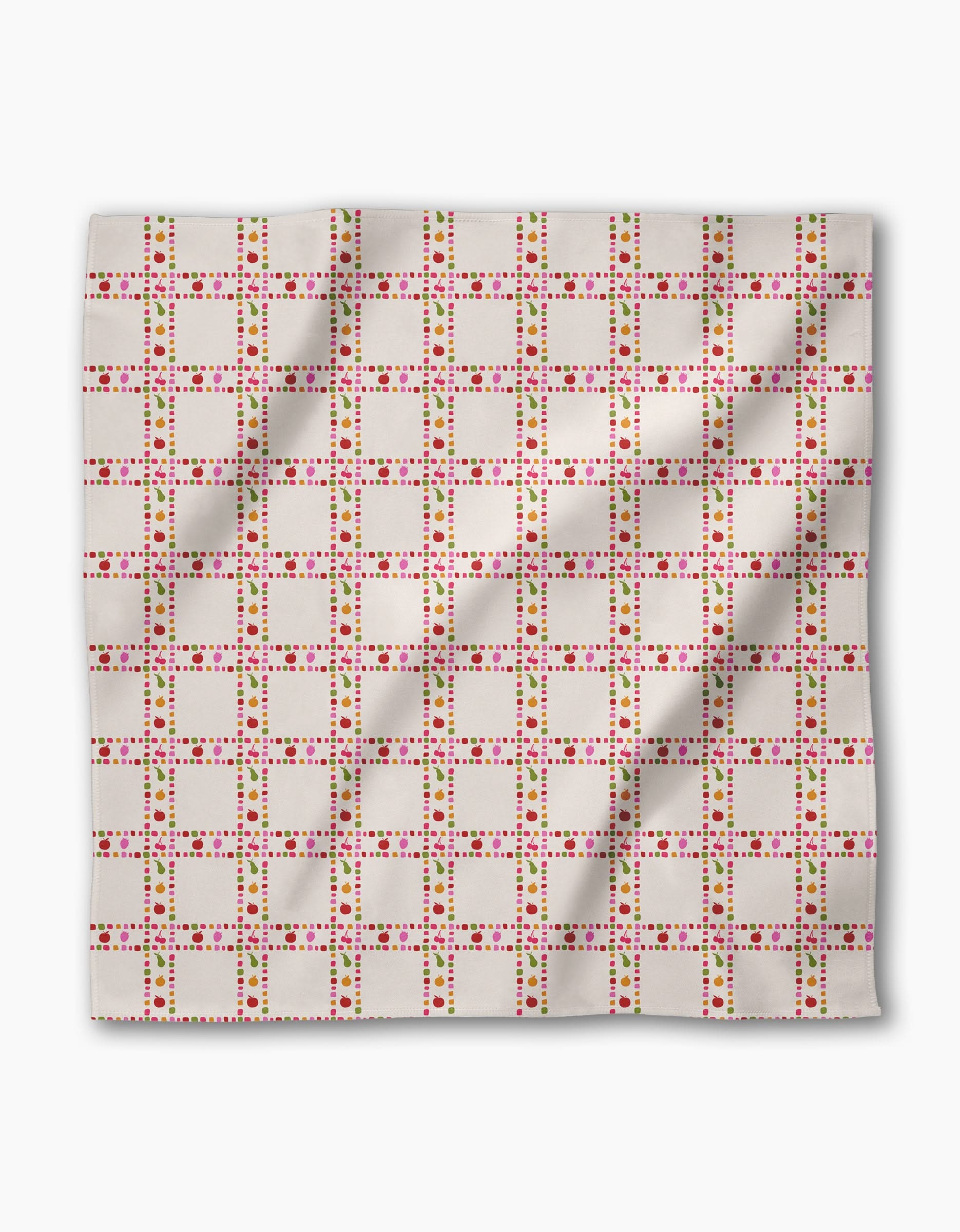 Fruits Plaid by Geometry is a rectangular Geosuede cloth featuring a grid of pink, red, and green squares and dots on white. Made from recycled materials, the fabric shows slight wrinkles.