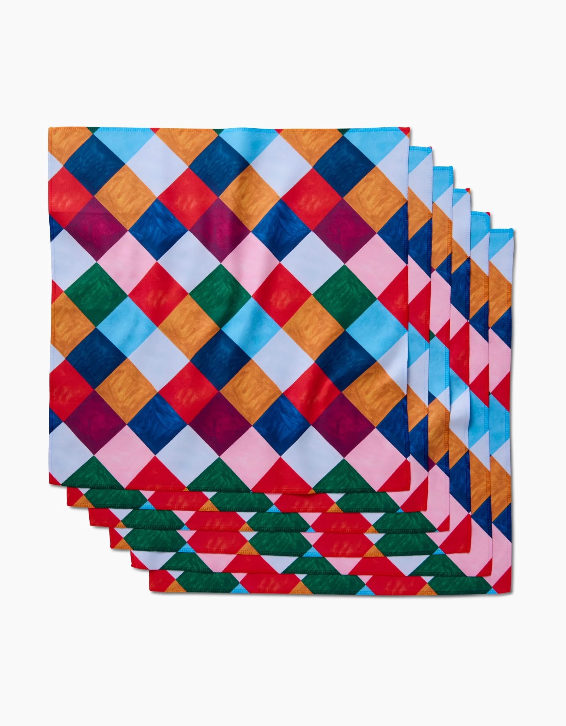 Holiday Harlequin by Daria Solak: a set of six reusable dinner napkins, each with a bold diamond checkered pattern in red, blue, green, orange, pink, and white—an eco-friendly and colorful addition to any table.