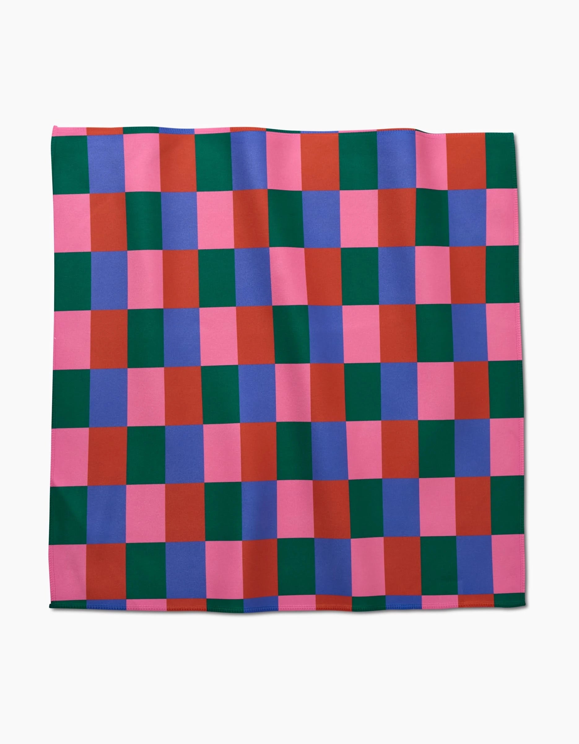 The Holiday Patchwork blanket by Laura Supnik features a lively checkerboard of pink, red, green, and purple squares on white, inspired by the playful flair of vibrant dinner napkins.