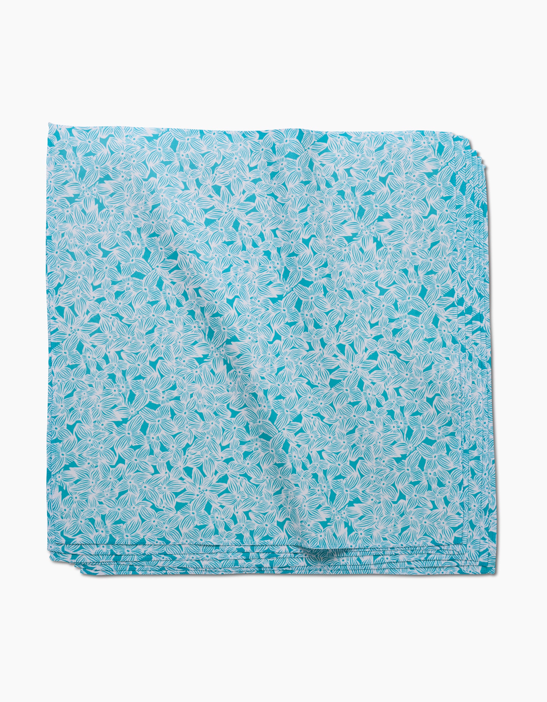 A neatly folded GEOMETRY Hydrangea square in light blue Geosuede, featuring a white leaf pattern, displayed on a plain white background.