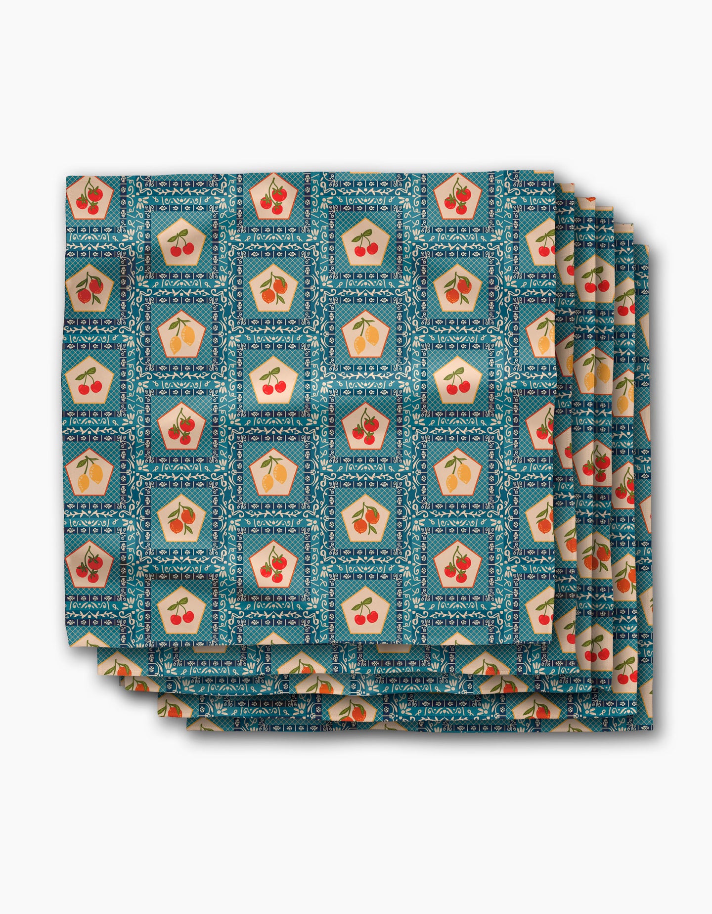 A folded Geosuede fabric cloth from Geometry, featuring the Italian Tiles design with a repeating pattern on a blue geometric background—perfect as a Dinner Napkin Set.