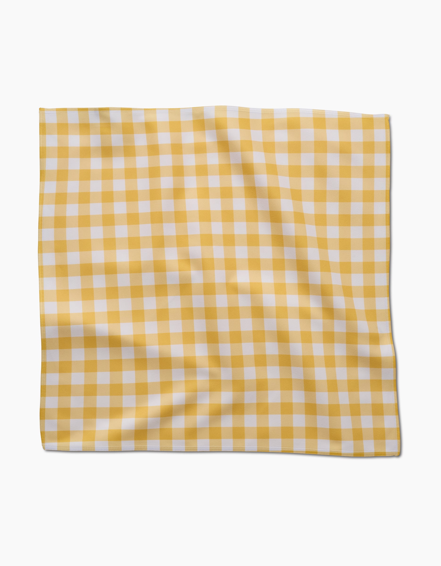 The Lemon Gingham Dinner Napkin Set by GEOMETRY, featuring a yellow and white gingham check pattern in Geosuede fabric, is shown flat against a white background with subtle folds.