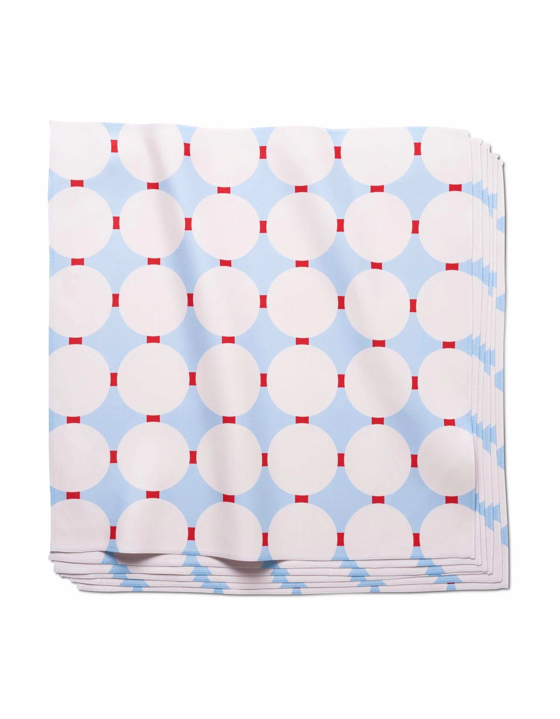 The Mist Blue Oasis dinner napkins by Happy Hemera feature a geometric pattern of white circles and red rectangles on a light blue background, crafted from soft Geosuede fabric for an elegant touch.