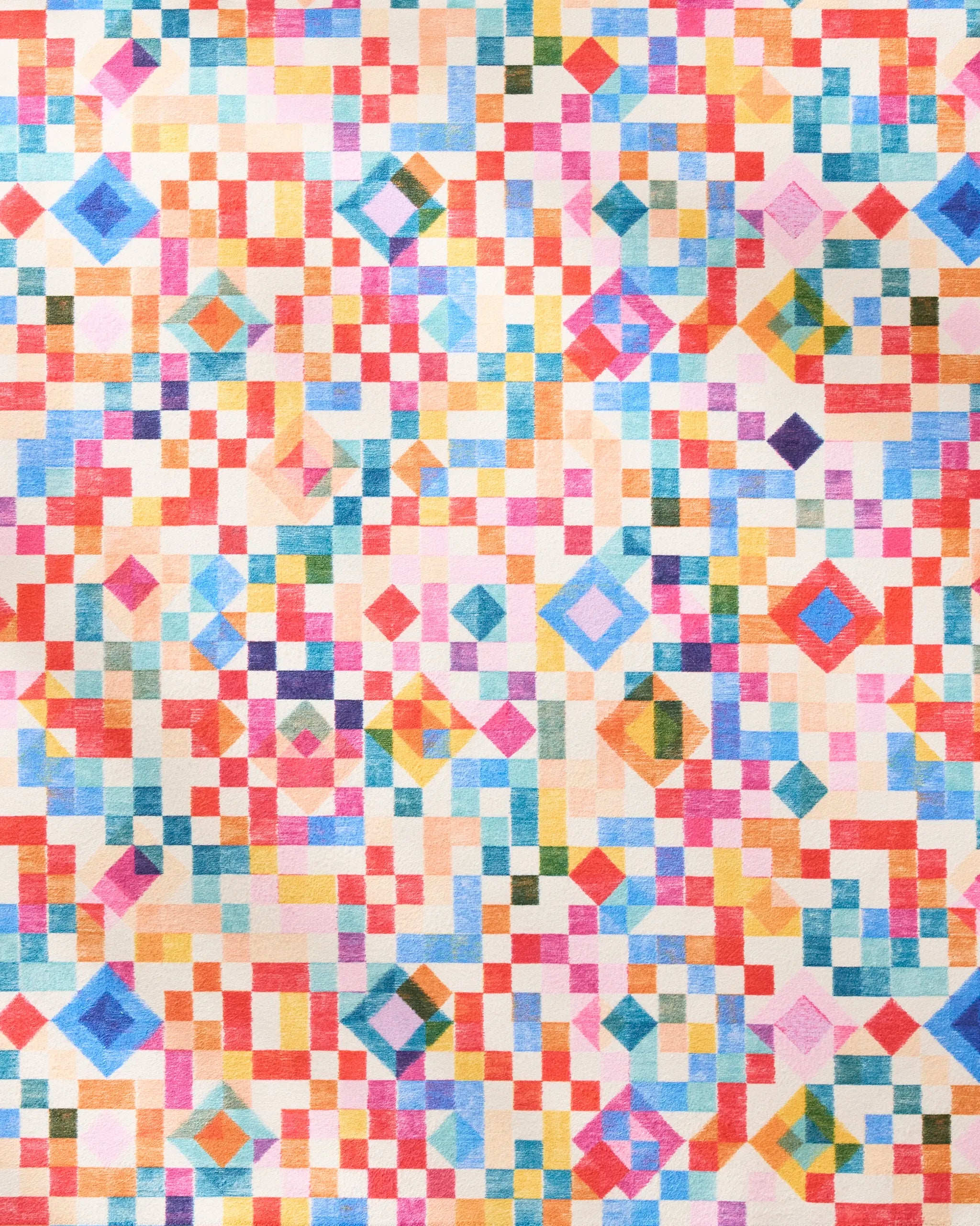 The Patchwork Geo dinner napkin set by Rachel Parker features a vibrant grid of multicolored squares, rectangles, and diamonds, creating a bold kaleidoscopic effect—perfect for stylish, sustainable dining.