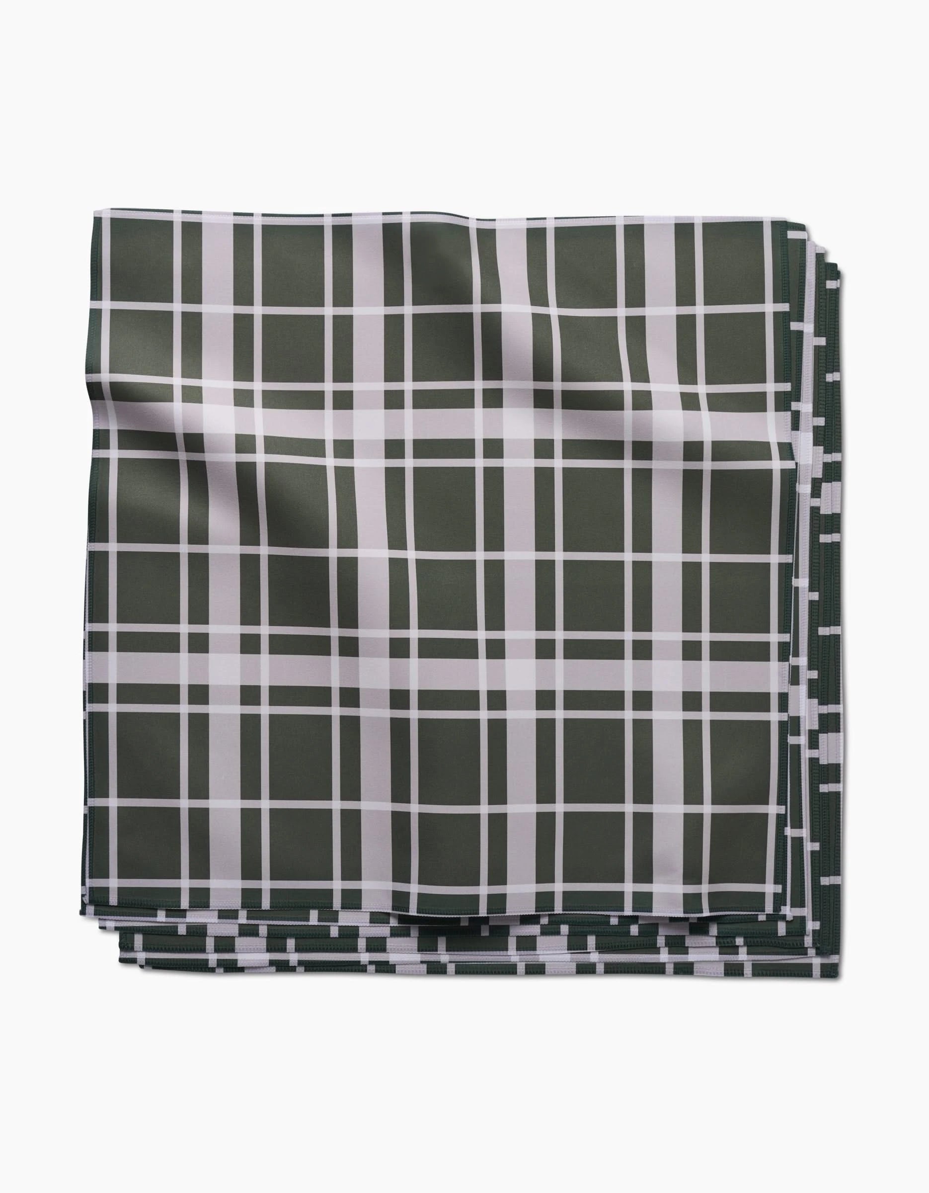 The Aubrey Fairchild Picnic Time Green set features folded dinner napkins in Geosuede fabric with a white plaid pattern, shown flat on a white background.