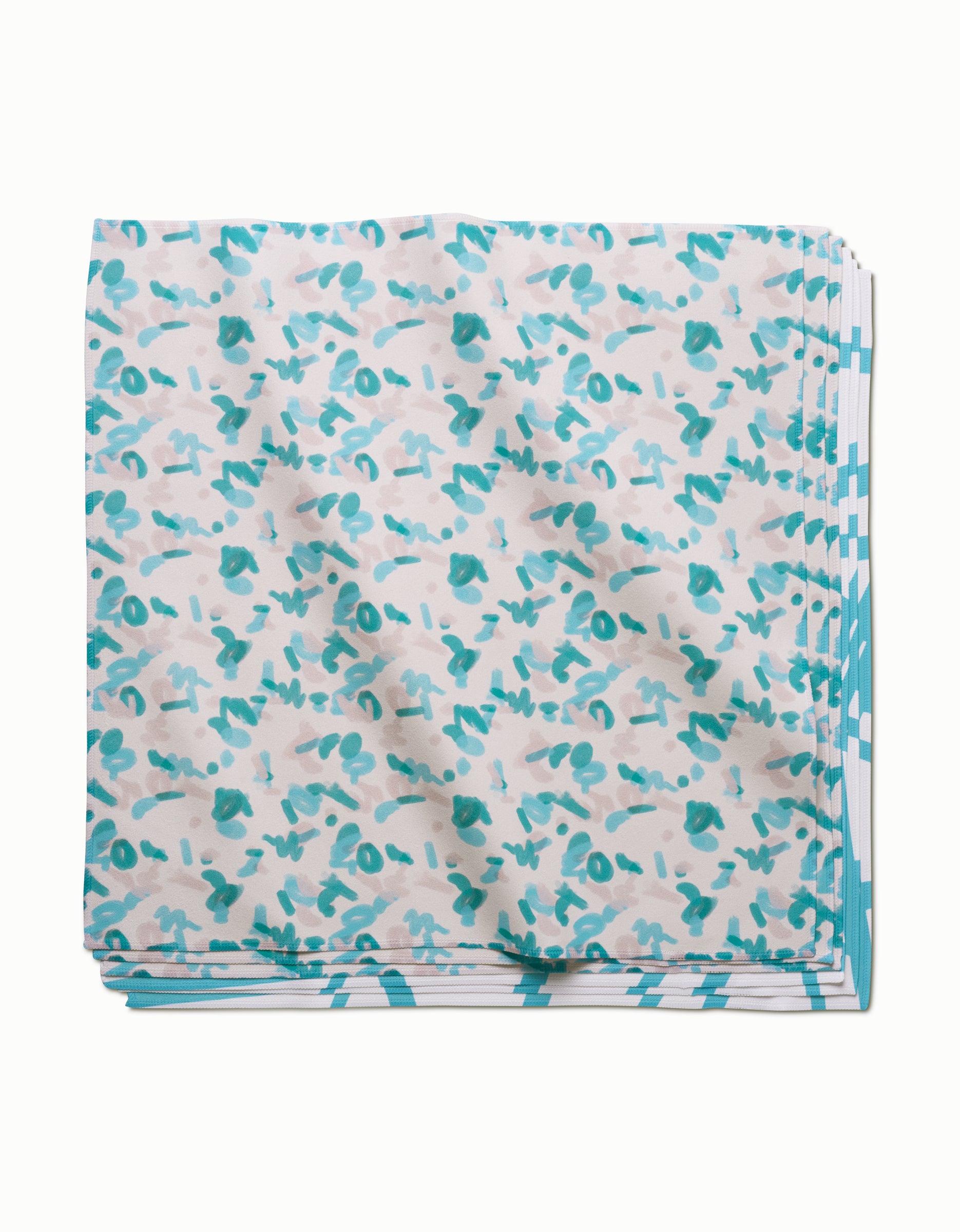 The GEOMETRY Playful Blues eco-friendly dinner napkin features a white background with teal and gray abstract shapes plus a teal-and-white patterned border.