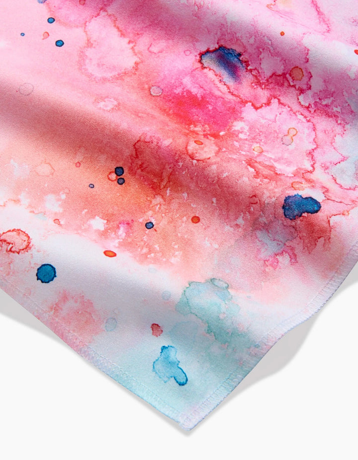 A close-up of Sara Maris Splash of Love shows vibrant watercolor patterns in pink, red, and blue with abstract splashes—an artistic touch perfect for a stylish Dinner Napkin Set.