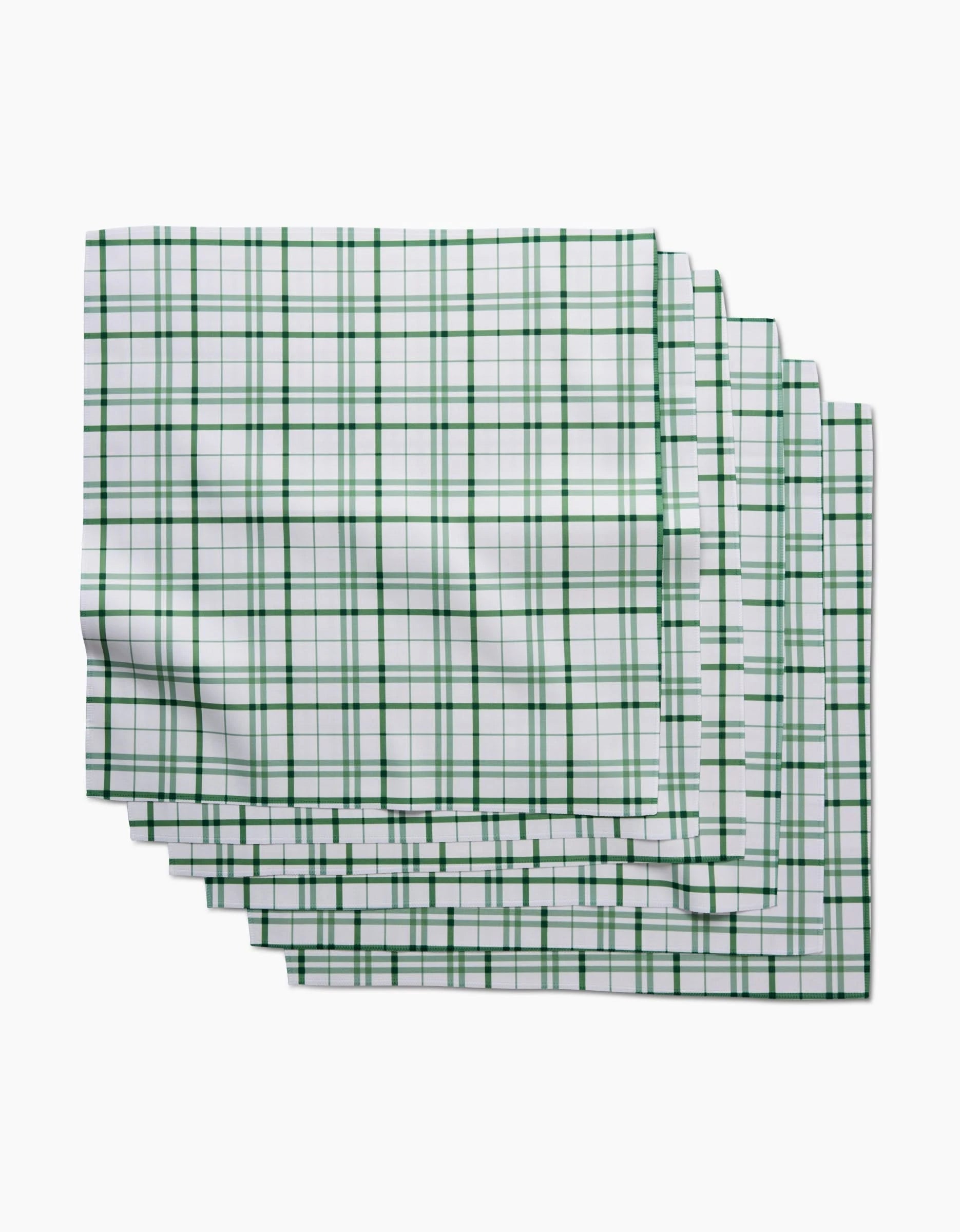 Five Spring Picnic Plaid kitchen towels by Hufton Studio, featuring a green checkered pattern on white and made from post-consumer recycled materials, are stacked with slight overlap on a white background.
