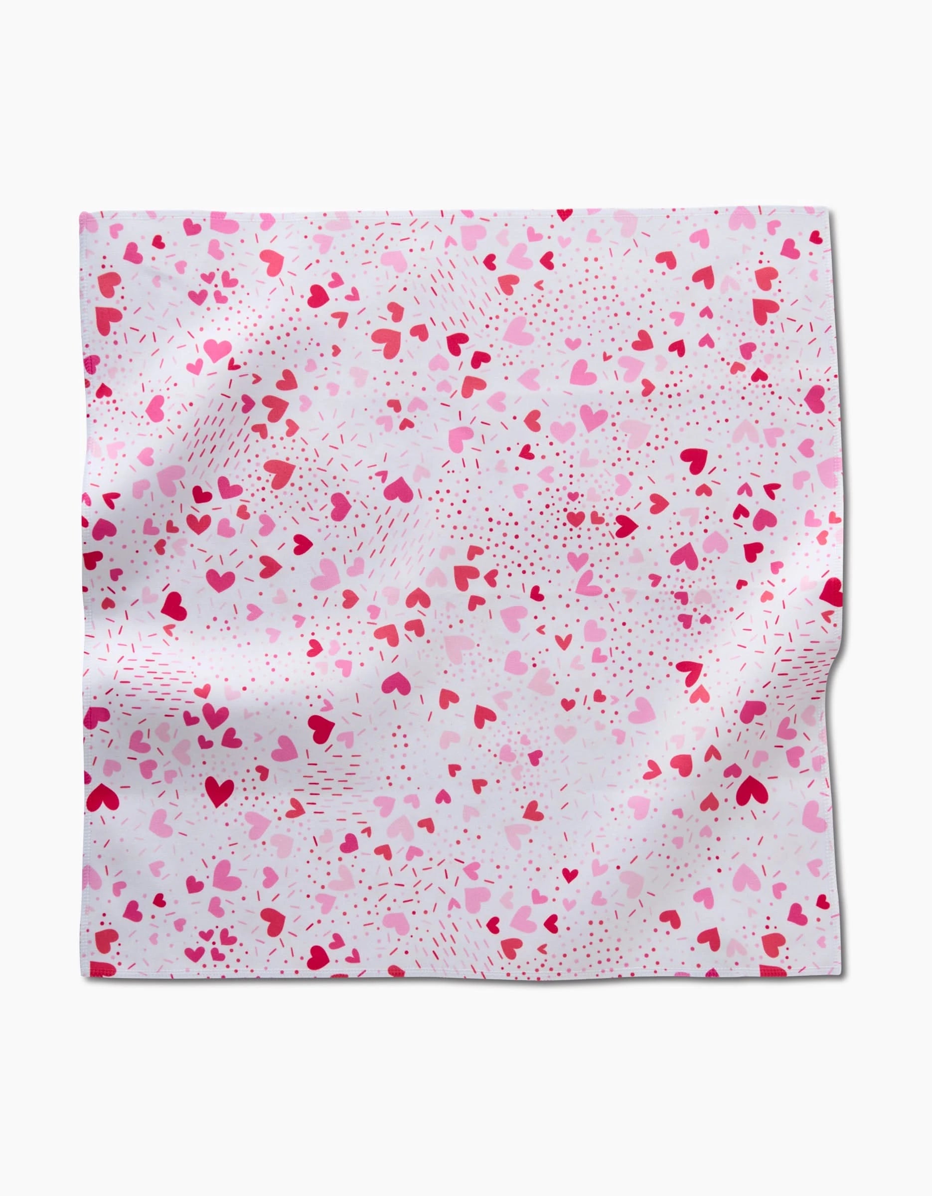 The Sprinkled With Love napkin by Rebecca Bobko is a square, eco-friendly fabric featuring small pink and red hearts on white—smooth and gently folded, it’s perfect for adding charm to your table setting.