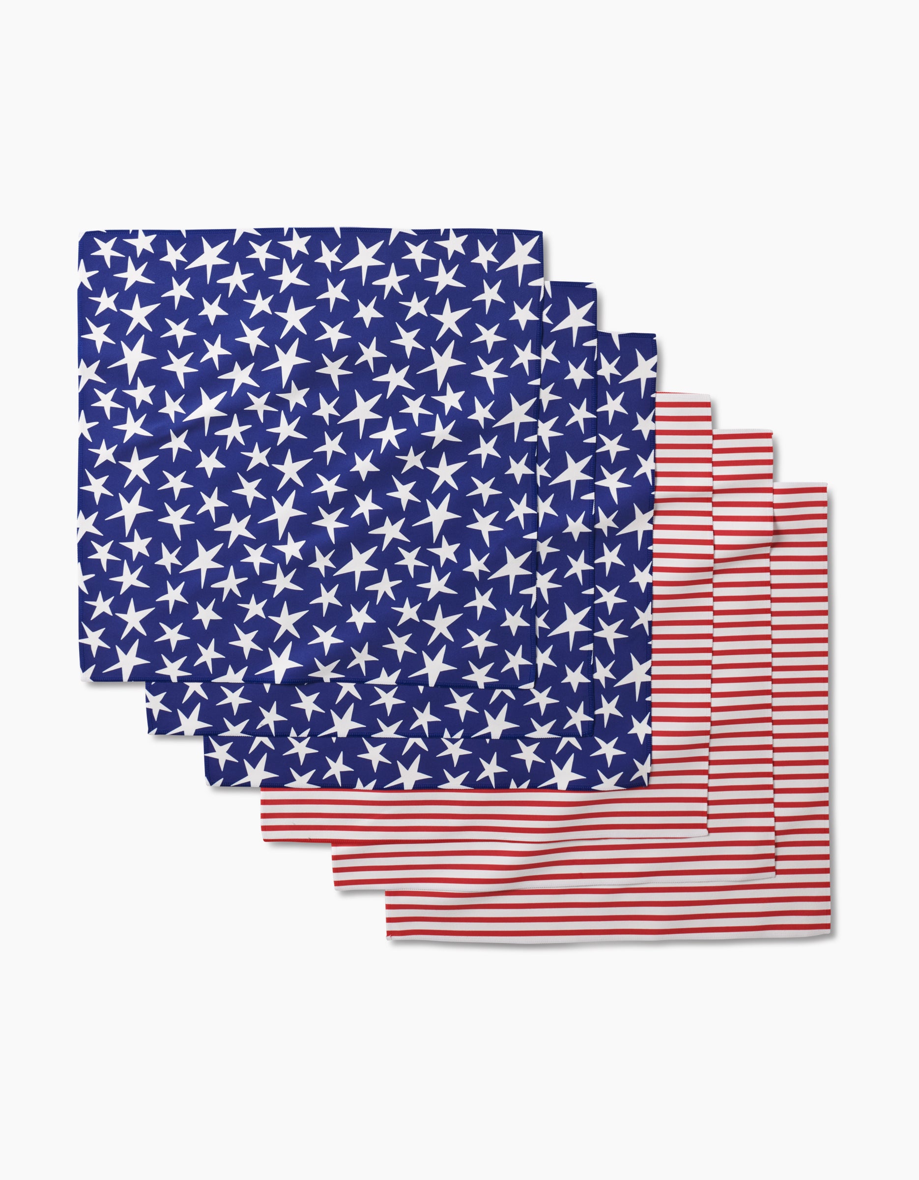 The Mindfulnice Stars And Stripes Dinner Napkin Set includes six napkins made from recycled materials: three with blue and white stars, and three with red and white stripes, inspired by the American flag.