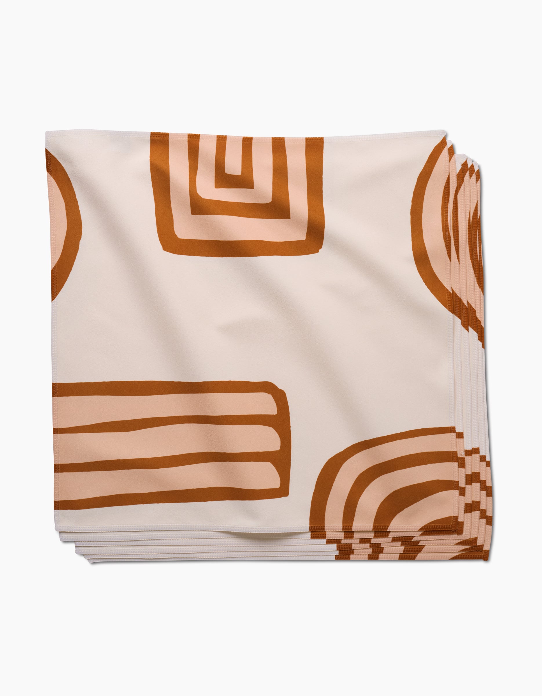 Terracotta Vibes by GEOMETRY: absorbent cloth dinner napkins with a cream background and bold, rust-orange geometric patterns—functional and stylish for any table.