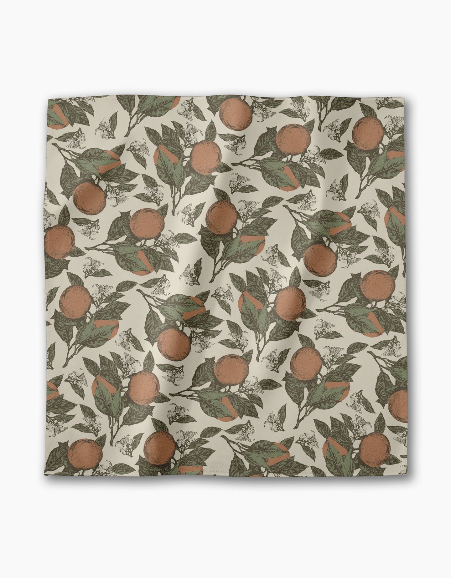 The Geometry Valencia dinner napkin features a square, absorbent cloth with vintage-style oranges and green leaves on a cream background—perfect for any table setting.