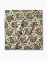 The Geometry Valencia dinner napkin features a square, absorbent cloth with vintage-style oranges and green leaves on a cream background—perfect for any table setting.