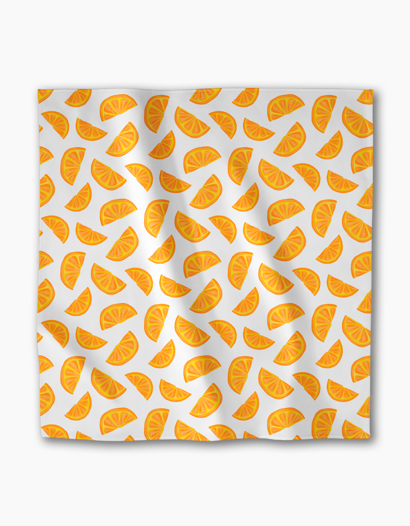 The Zesty Slice by Aubrey Fairchild is a white Geosuede fabric cloth with a lively, mult-directional pattern of orange slice illustrations across the surface.