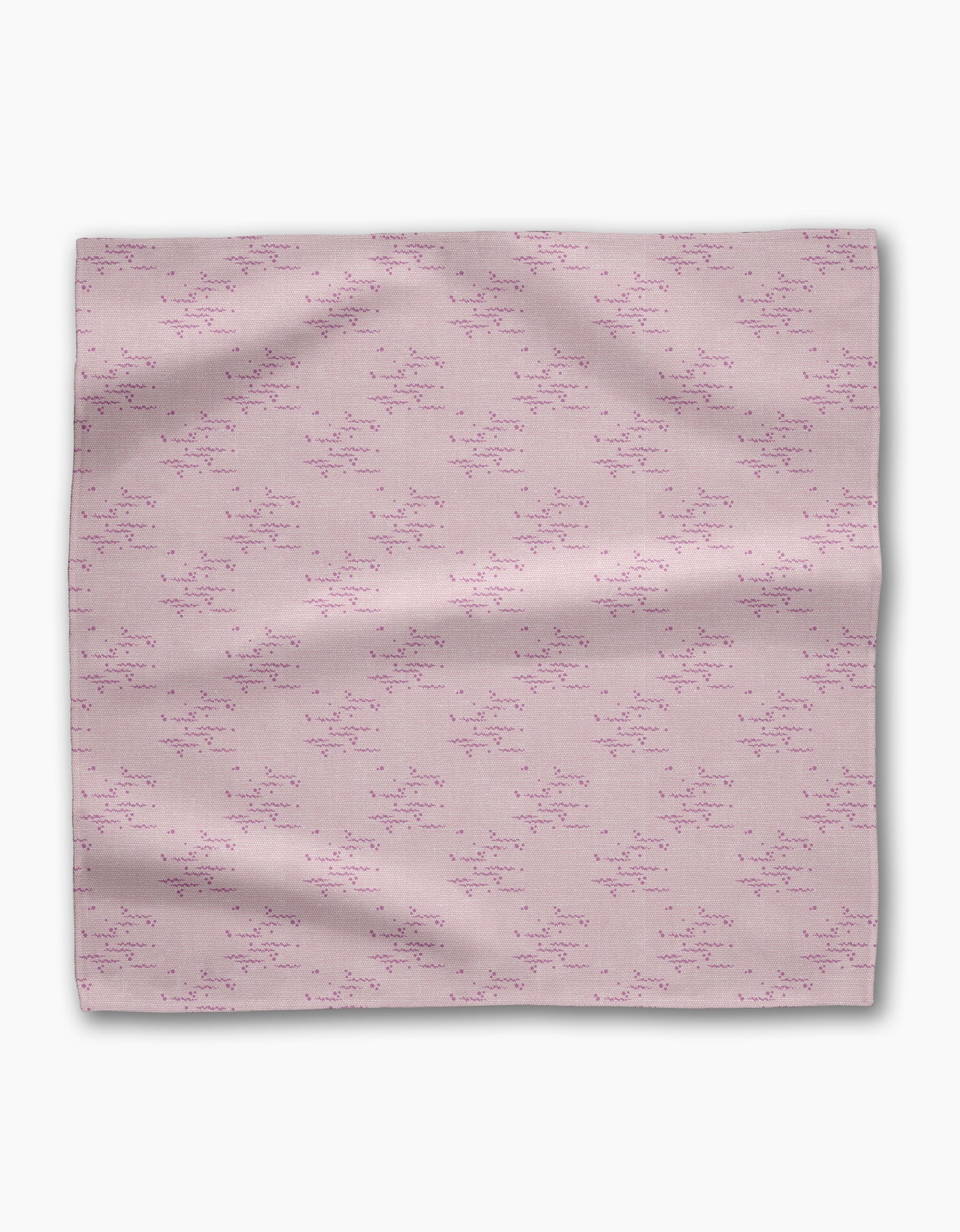 The Geometry Bubble Ditzy Dusty Rose is a soft pink reusable fabric napkin featuring a subtle pattern of small, scattered dark pink lines and dots, shown flat against a white background.