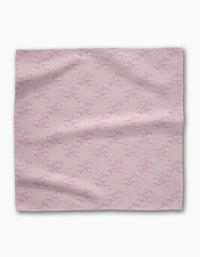 The Geometry Bubble Ditzy Dusty Rose is a soft pink reusable fabric napkin featuring a subtle pattern of small, scattered dark pink lines and dots, shown flat against a white background.