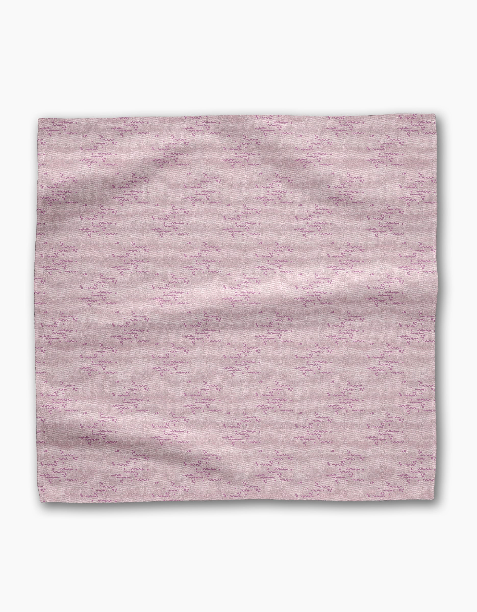 The Geometry Bubble Ditzy Dusty Rose is a soft pink reusable fabric napkin featuring a subtle pattern of small, scattered dark pink lines and dots, shown flat against a white background.